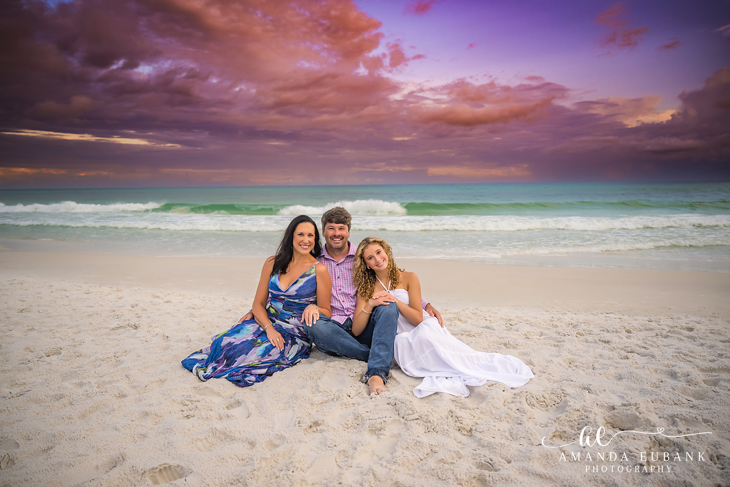Santa Rosa Beach Family Photos – Relaxed Seated Portrait on 30A Three family members sitting on the sand at the Seagrove Beach waterline at sunset