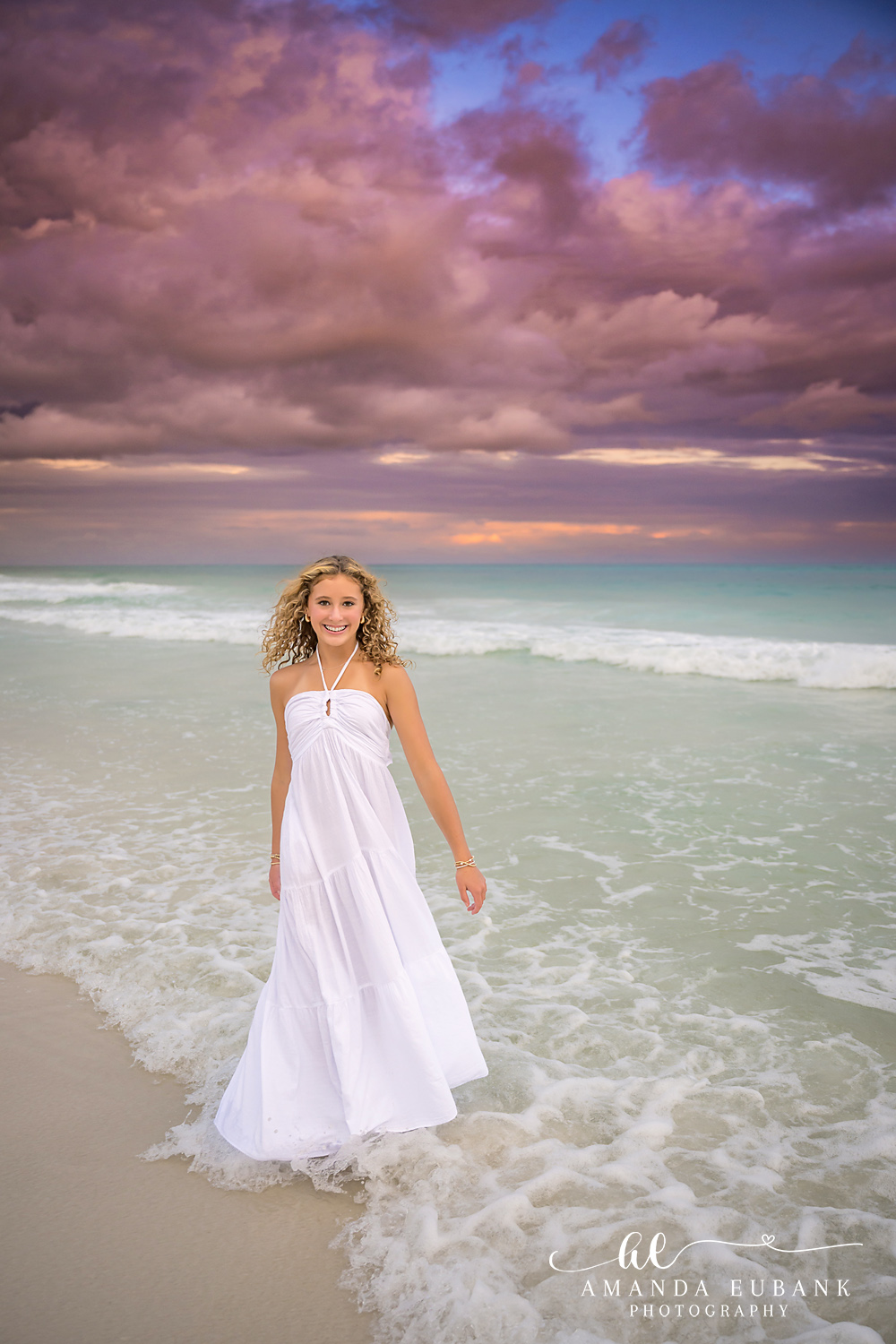 Santa Rosa Beach Photographer – Portrait in a White Dress at Sunset Girl in a flowing white dress walking through the surf at Seagrove Beach on 30A at sunset