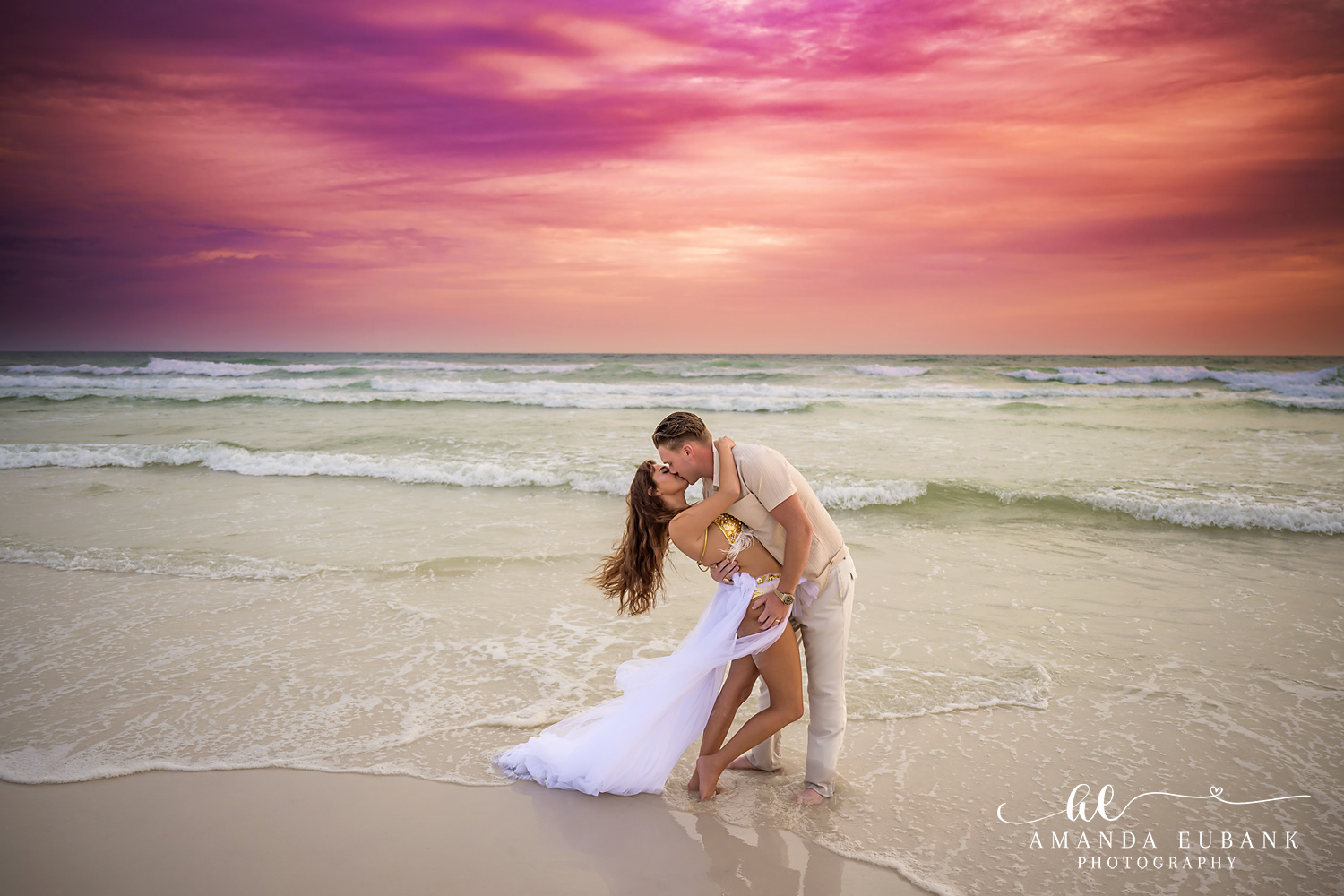Dune Allen Beach Couples Portrait in the Emerald Gulf Surf Couple leaning into each other at the edge of the Gulf as the 30A sky turns rose