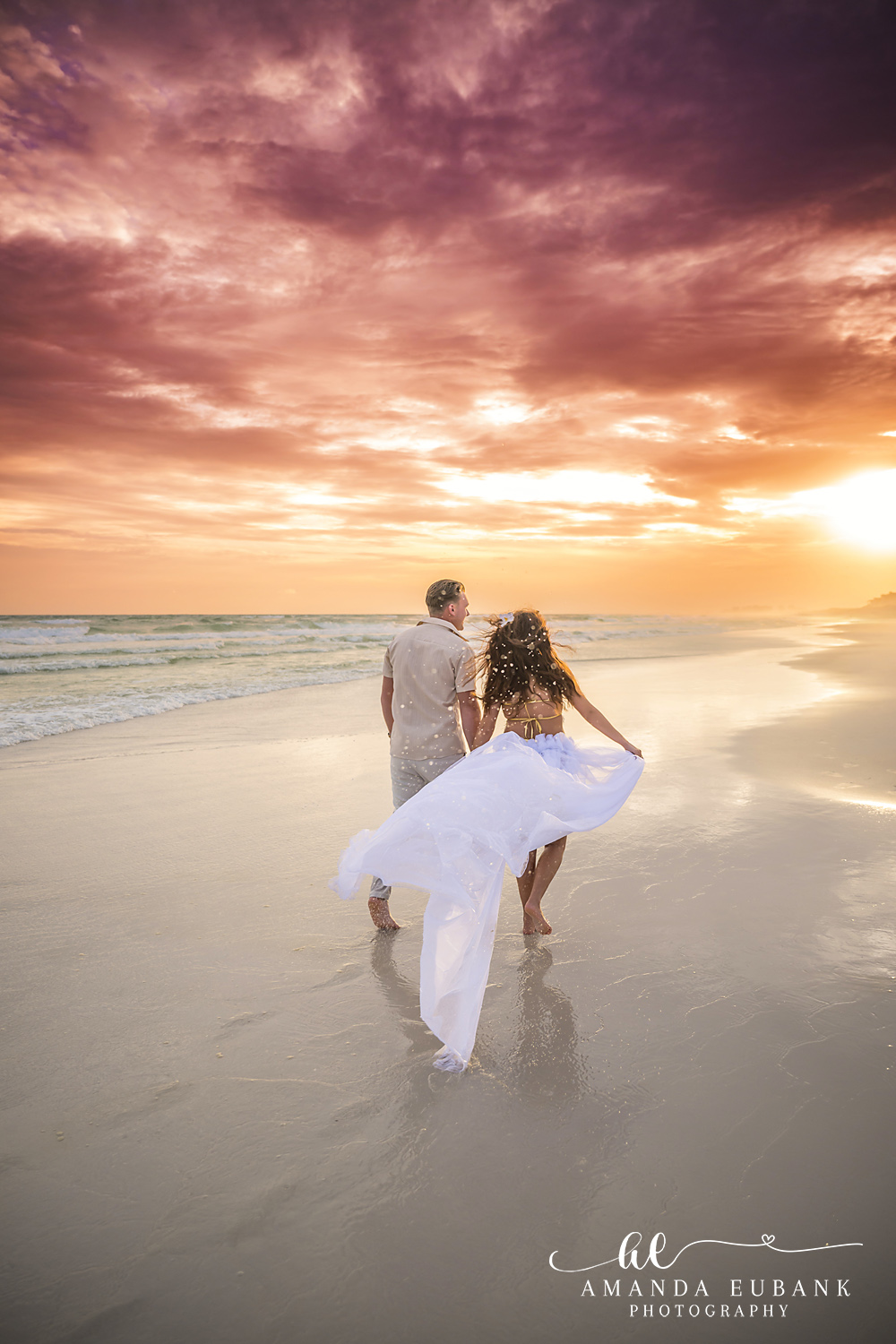 Dune Allen Beach Sunset Couples Session on the Emerald Coast Couple walking away down the beach into a gold sunburst at Dune Allen Beach on 30A