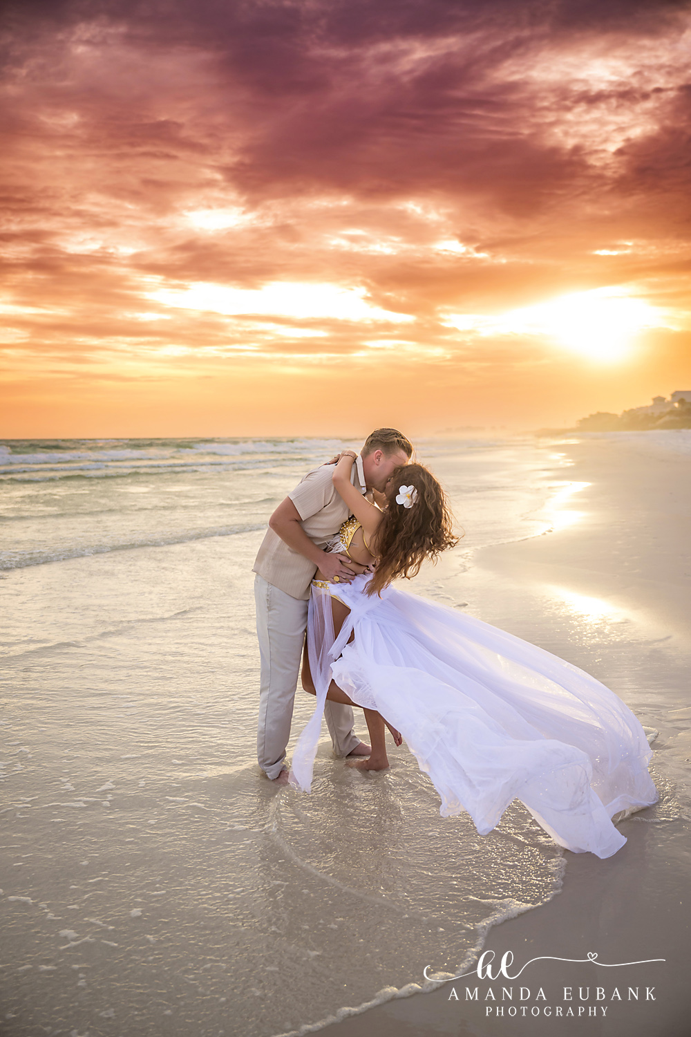 Dune Allen Beach Engagement Photographer – Backlit Golden Kiss Couple dipping into a kiss at the waterline as the sun sets over the Gulf on 30A