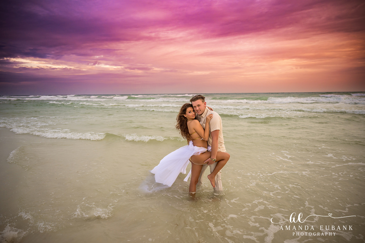 Dune Allen Beach Couples Photos in the Shallow Waves Couple standing knee deep in the Gulf during a Dune Allen Beach sunset couples session