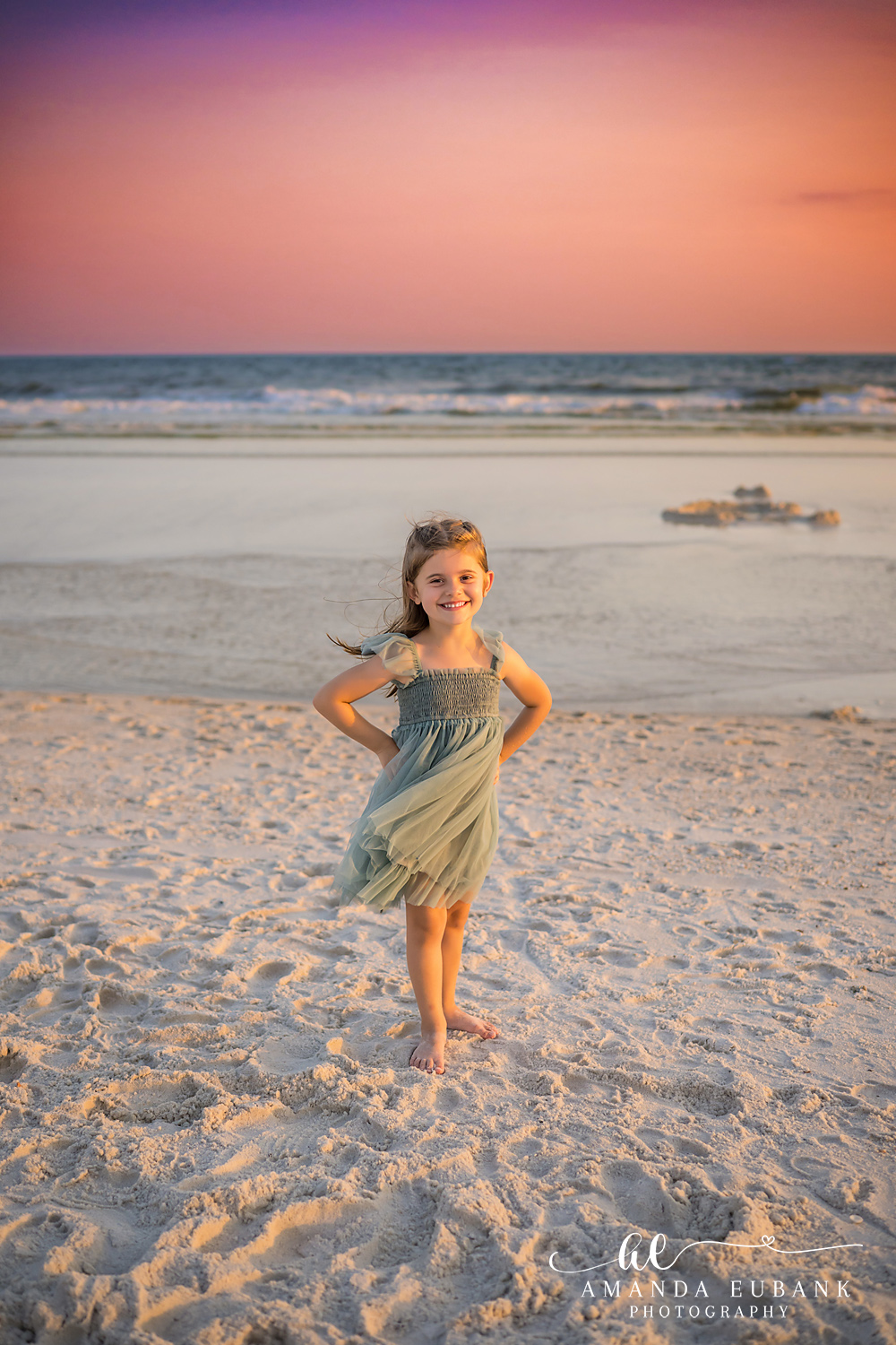 Carillon Beach Photographer – Walking the Shoreline Alone Girl in a sage green dress walking along the shoreline in Carillon Beach, Florida