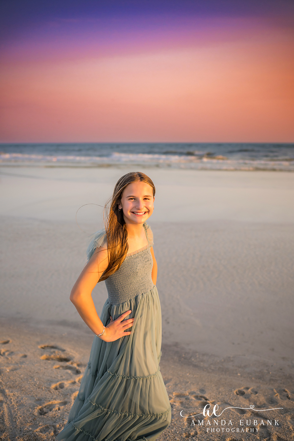 Carillon Beach Photographer – Solo Portrait on the Beach Girl in a sage green dress standing alone on the beach in Carillon Beach, Florida