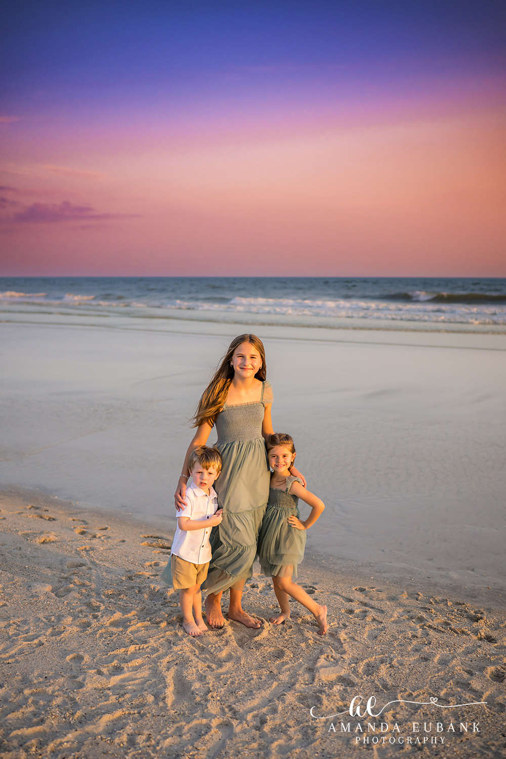 Carillon Beach Photographer – Mom and Kids Walking the Shore Mother walking with her two children along the beach in Carillon Beach, Florida