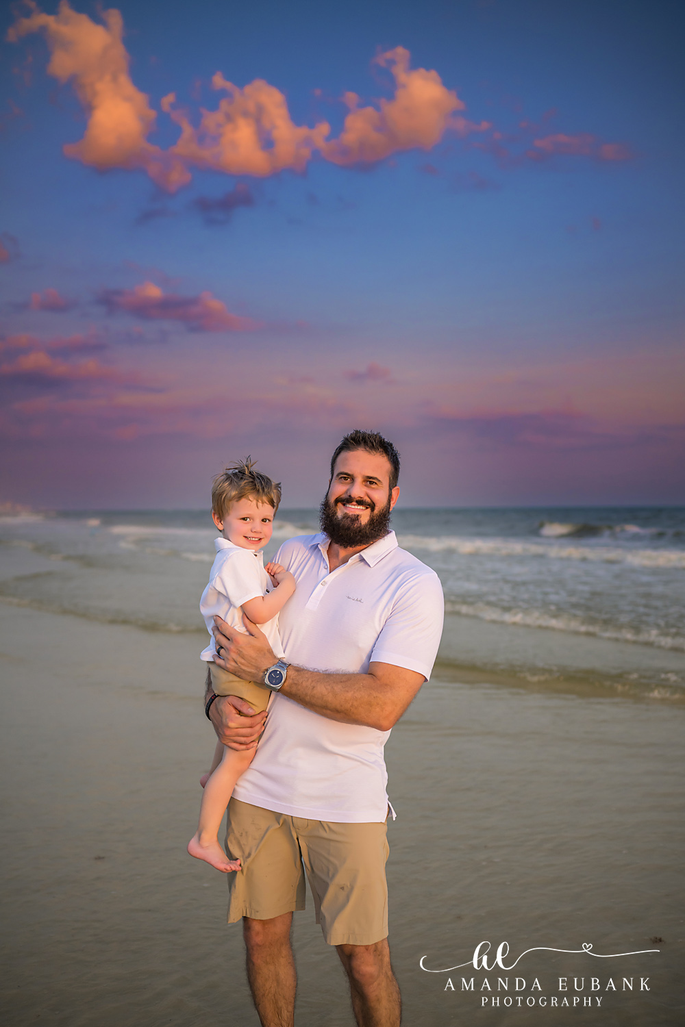 Carillon Beach Photographer – Dad Holding His Son Father holding his toddler son while walking on the beach in Carillon Beach, Florida