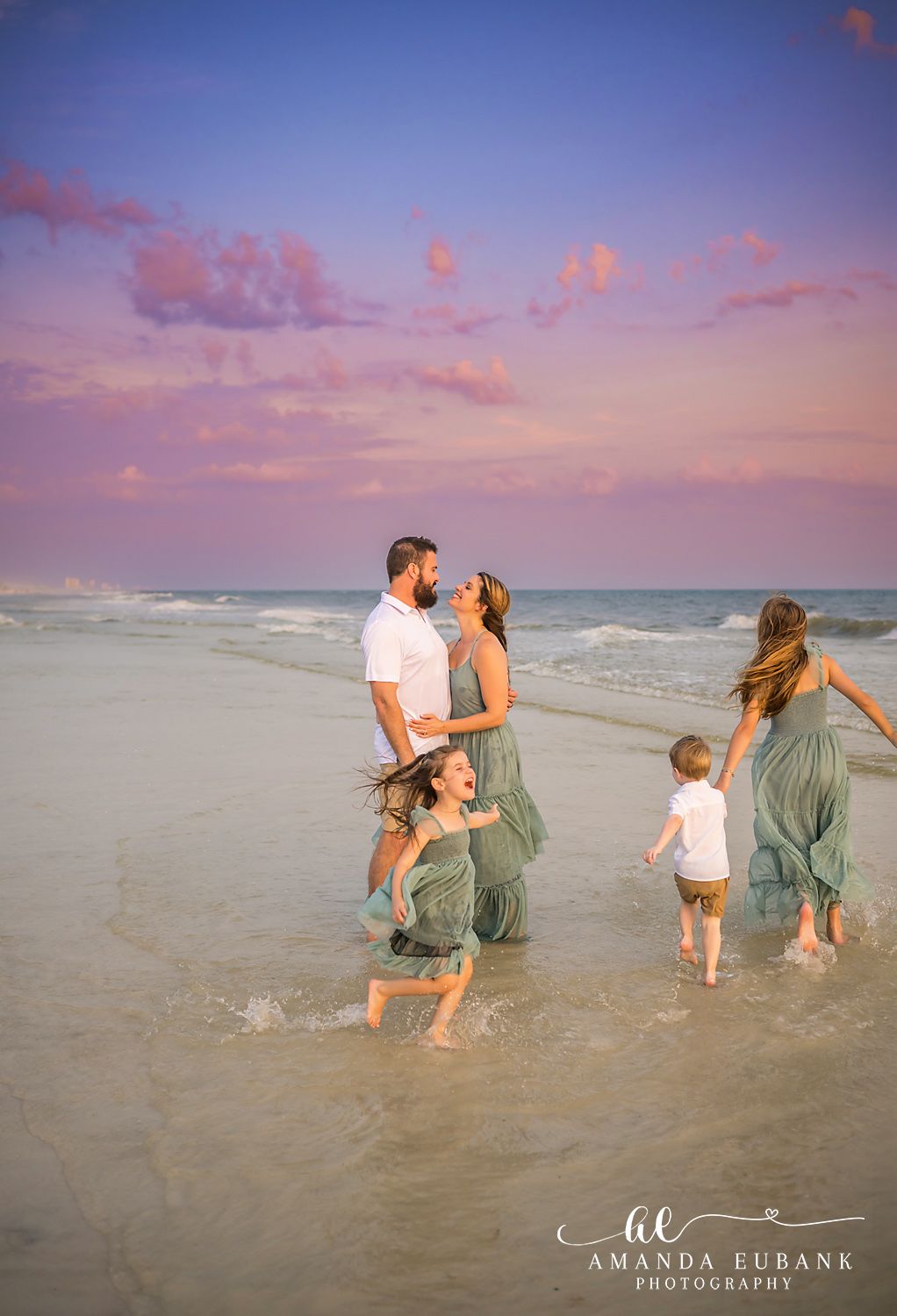 Carillon Beach Photographer – Dad and Kids in the Waves Father walking with his children through the waves in Carillon Beach, Florida