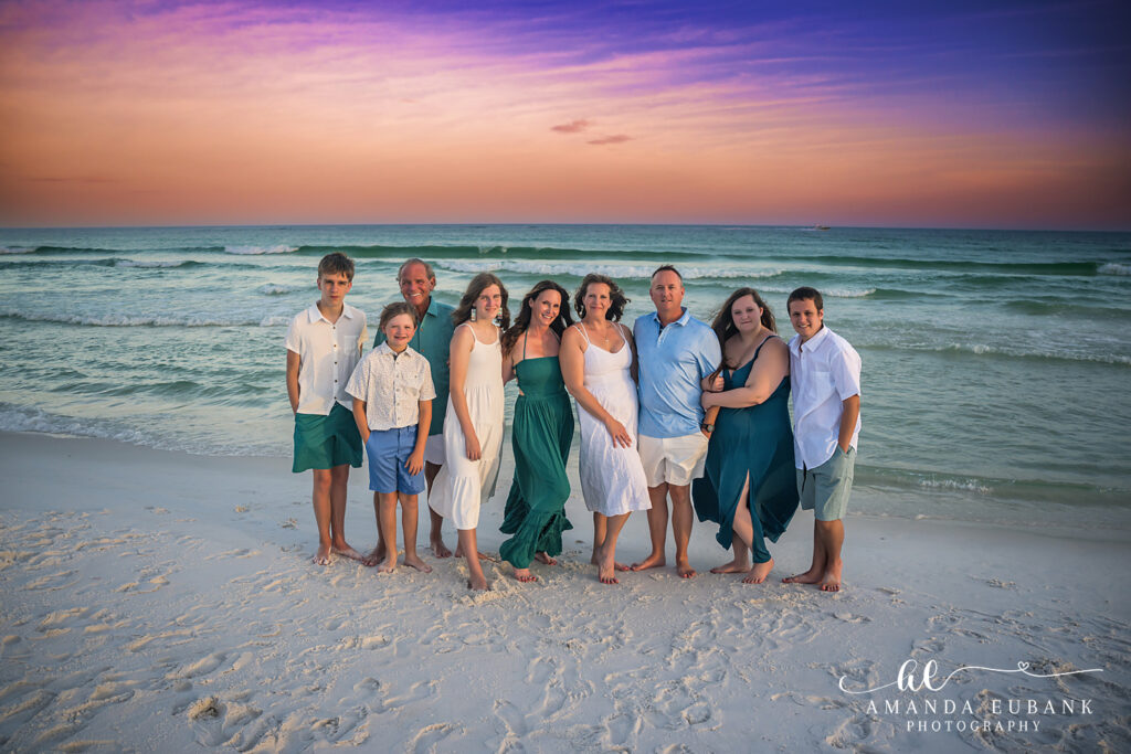 Large extended family group posing together on the beach in Destin, Florida
