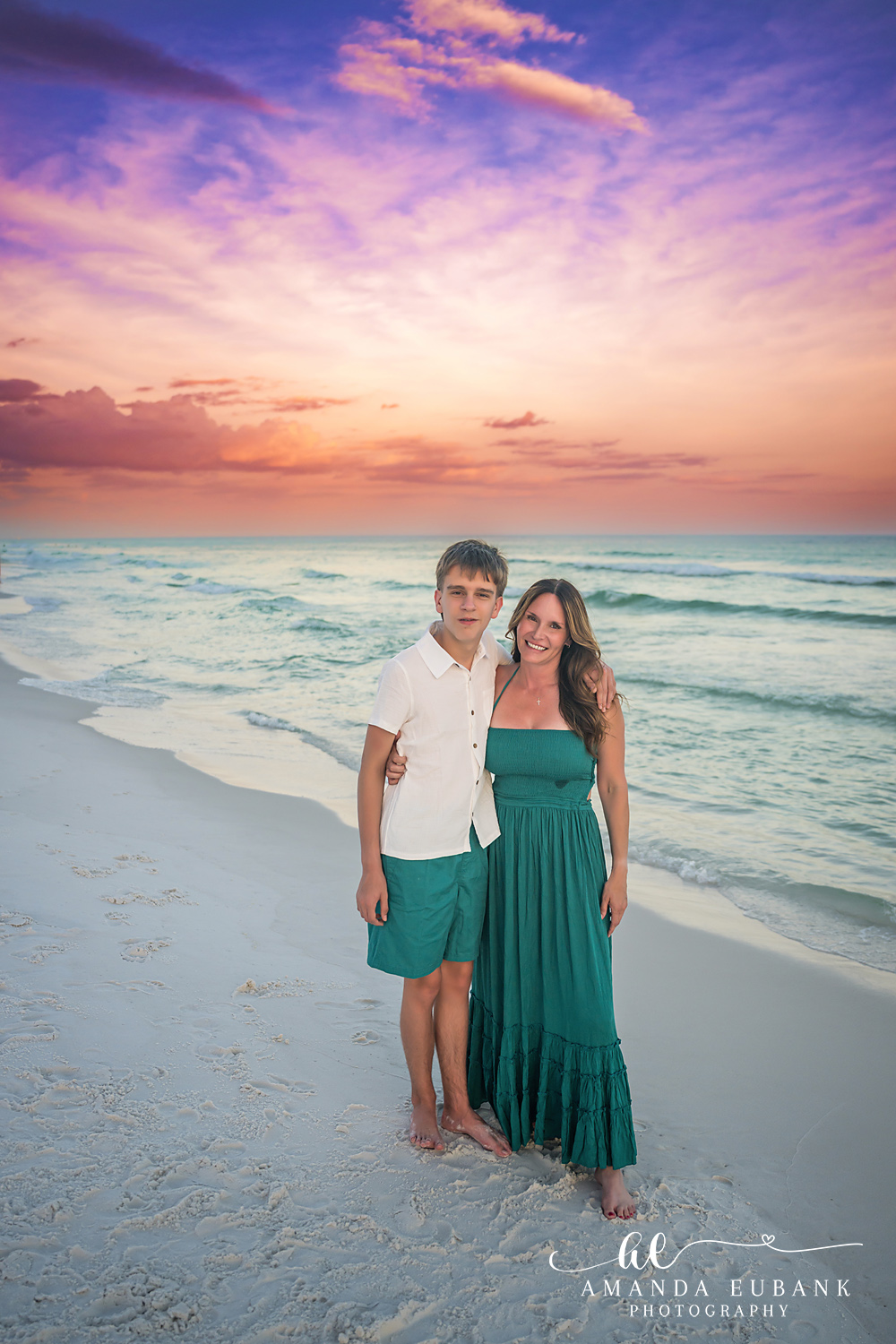 Destin Family Photographer – Mom and Kids on the Shoreline Mother posing with her two children on the beach in Destin, Florida
