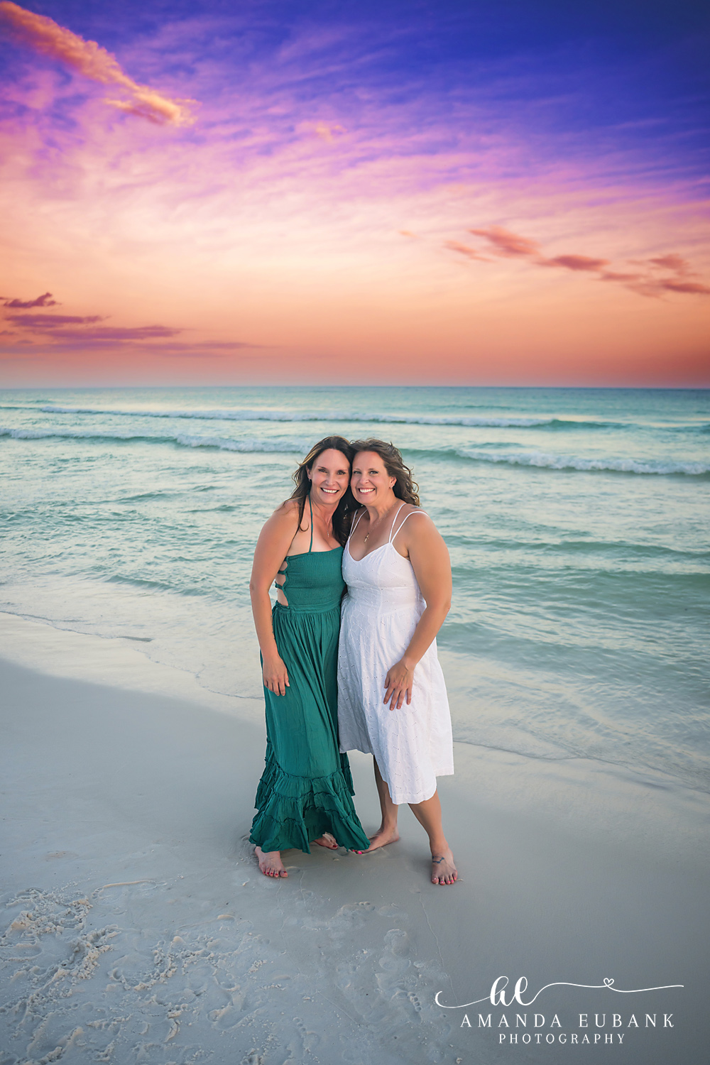 Destin Family Photographer – Mother and Daughter on the Shoreline Mother and daughter standing together on the beach shoreline in Destin, Florida