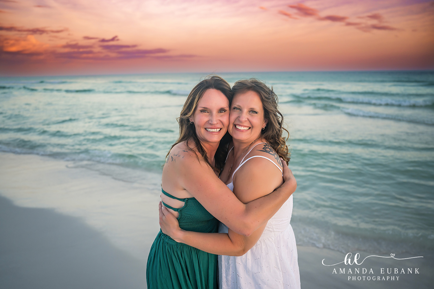 Destin Family Photographer – Mother and Daughter Embrace at Sunset Mother and daughter embracing on the beach at sunset in Destin, Florida