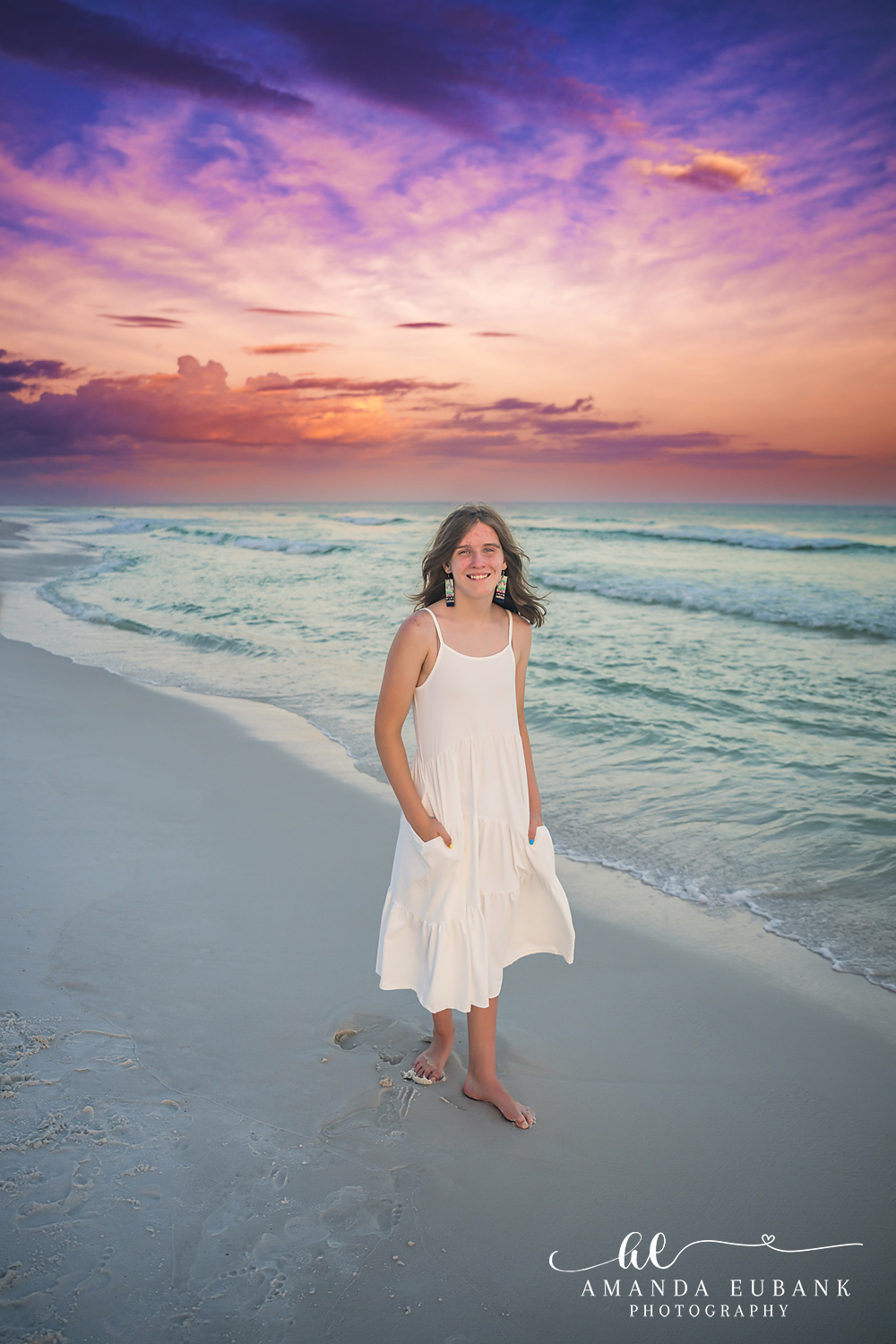 Destin Family Photographer – White Dress Portrait on the Beach Woman standing alone on the beach in a white dress in Destin, Florida