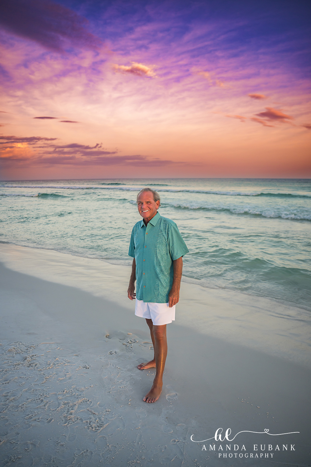 Destin Family Photographer – Solo Portrait in Teal Man standing alone on the beach in a teal shirt in Destin, Florida