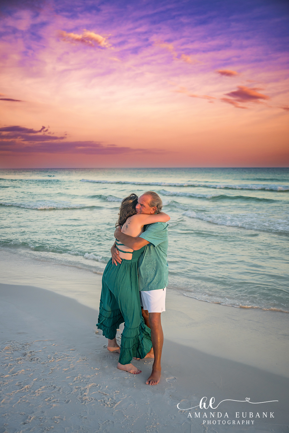Destin Family Photographer – Warm Couple Embrace Couple embracing warmly on the beach in Destin, Florida