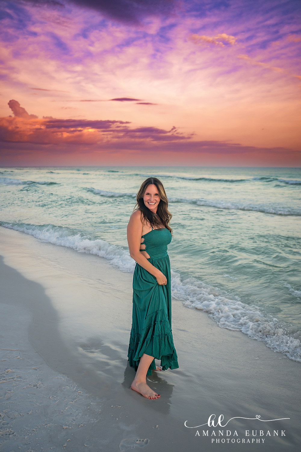Destin Family Photographer – Gazing at the Gulf in Teal Woman in a teal dress standing on the beach looking at the Gulf in Destin, Florida