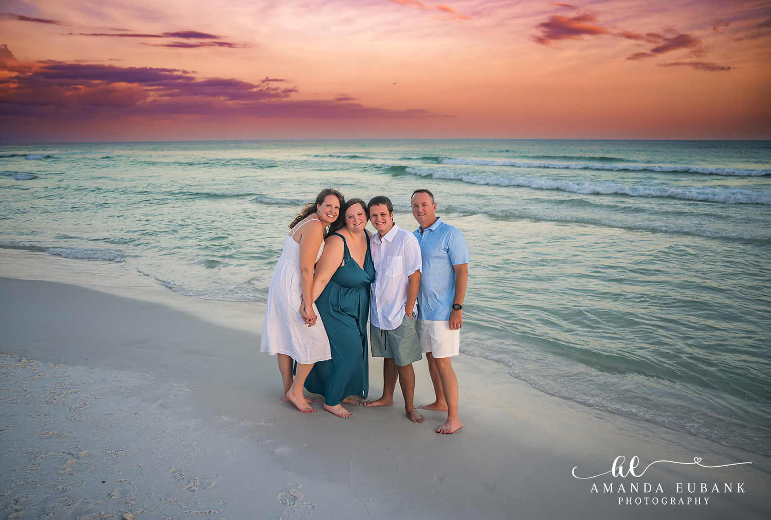 Destin Family Photographer – Family Trio on the Beach Family of three standing together on the beach in Destin, Florida
