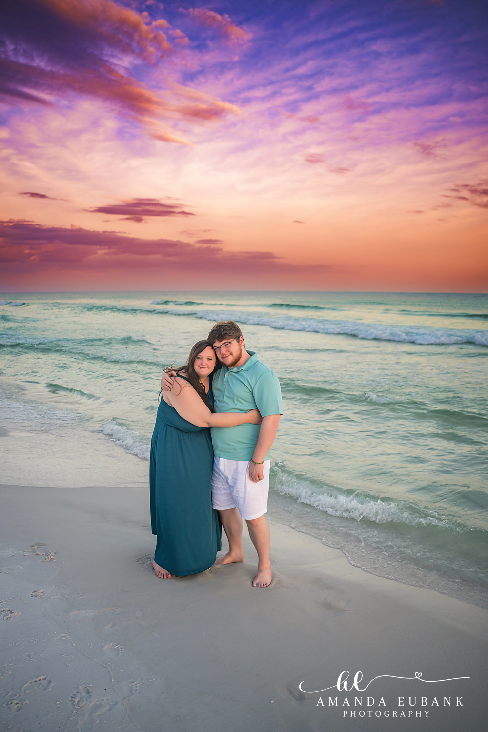 Destin Family Photographer – Couple Embrace at Sunset Couple embracing on the beach at sunset in Destin, Florida