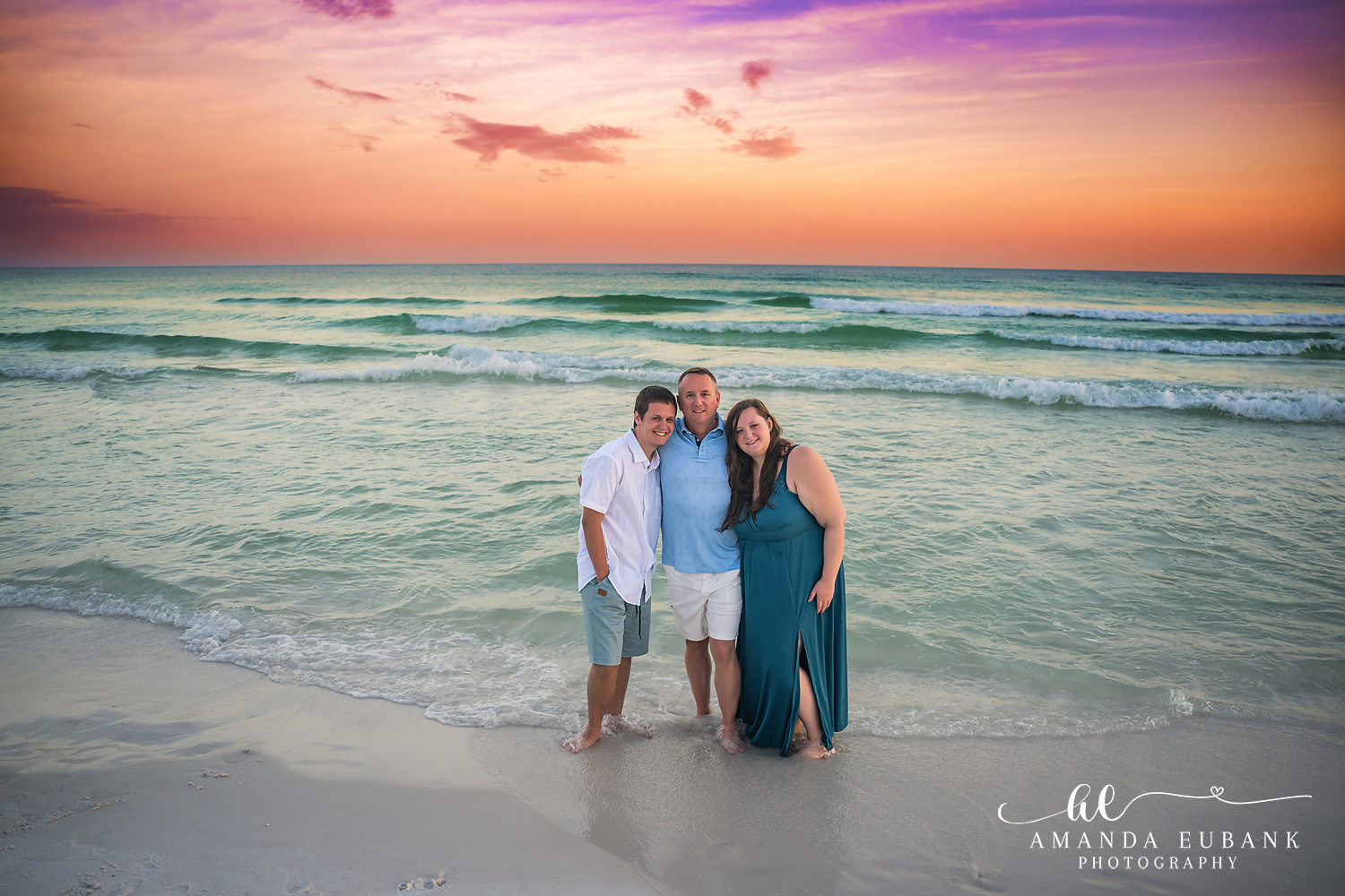 Destin Family Photographer – Family of Three on the Beach Family of three standing together on the beach in Destin, Florida