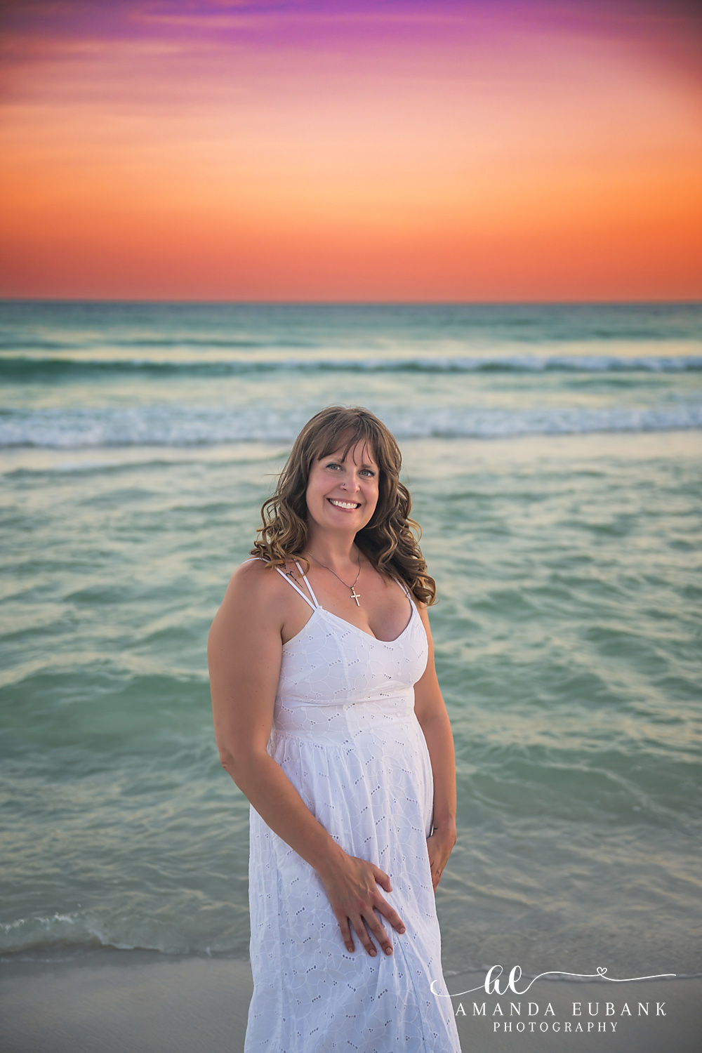 Destin Family Photographer – Close-Up Smile at Sunset Woman smiling in a close-up portrait on the beach at sunset in Destin, Florida