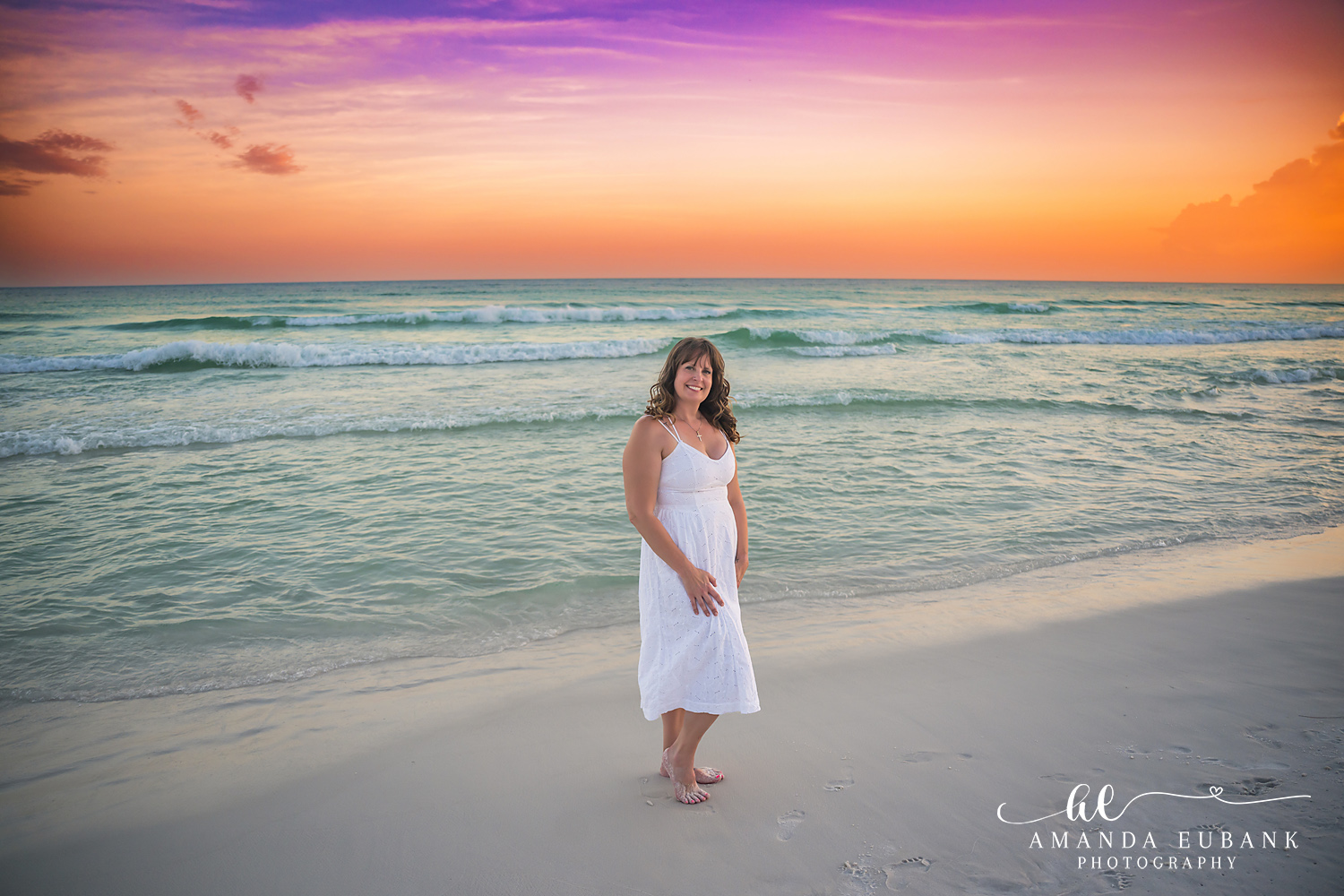 Destin Family Photographer – White Dress Solo Portrait Woman standing alone on the beach in a white dress in Destin, Florida