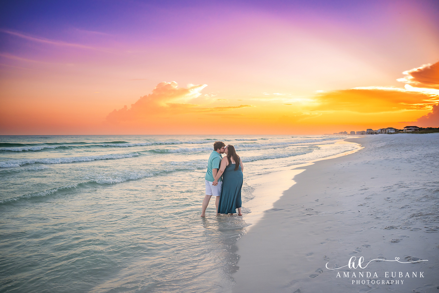 Destin Family Photographer – Couple Embracing at Golden Sunset Couple embracing on the beach under a golden sunset in Destin, Florida