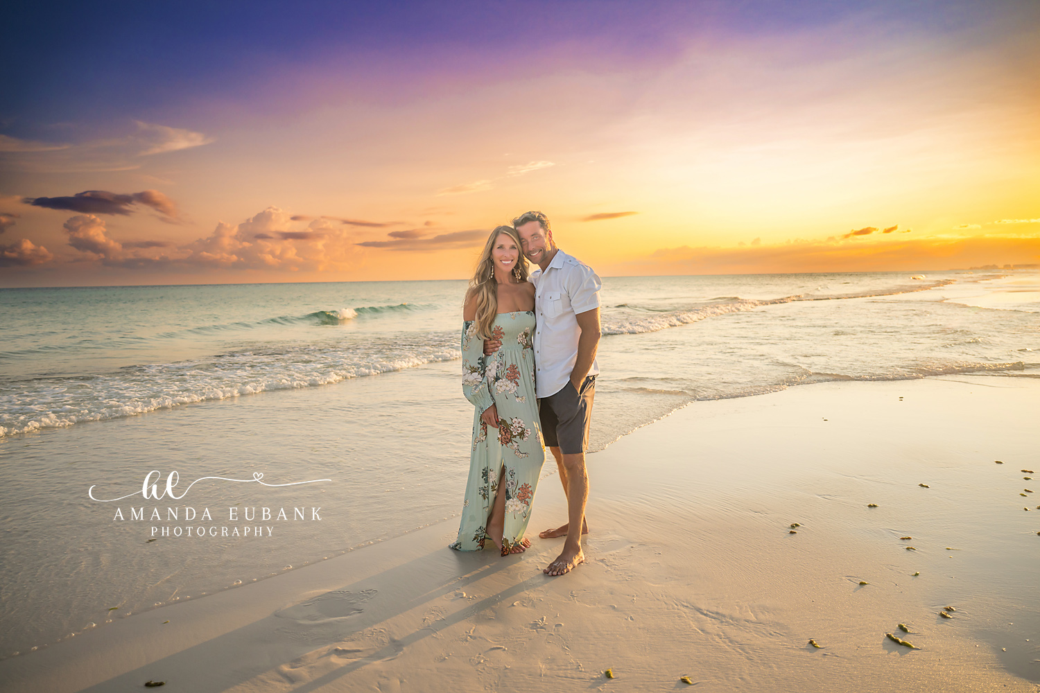 Destin Beach Family Session – Couple on the Shoreline at Sunset Couple standing together on the shoreline beneath a golden sunset during a Destin beach family photography session