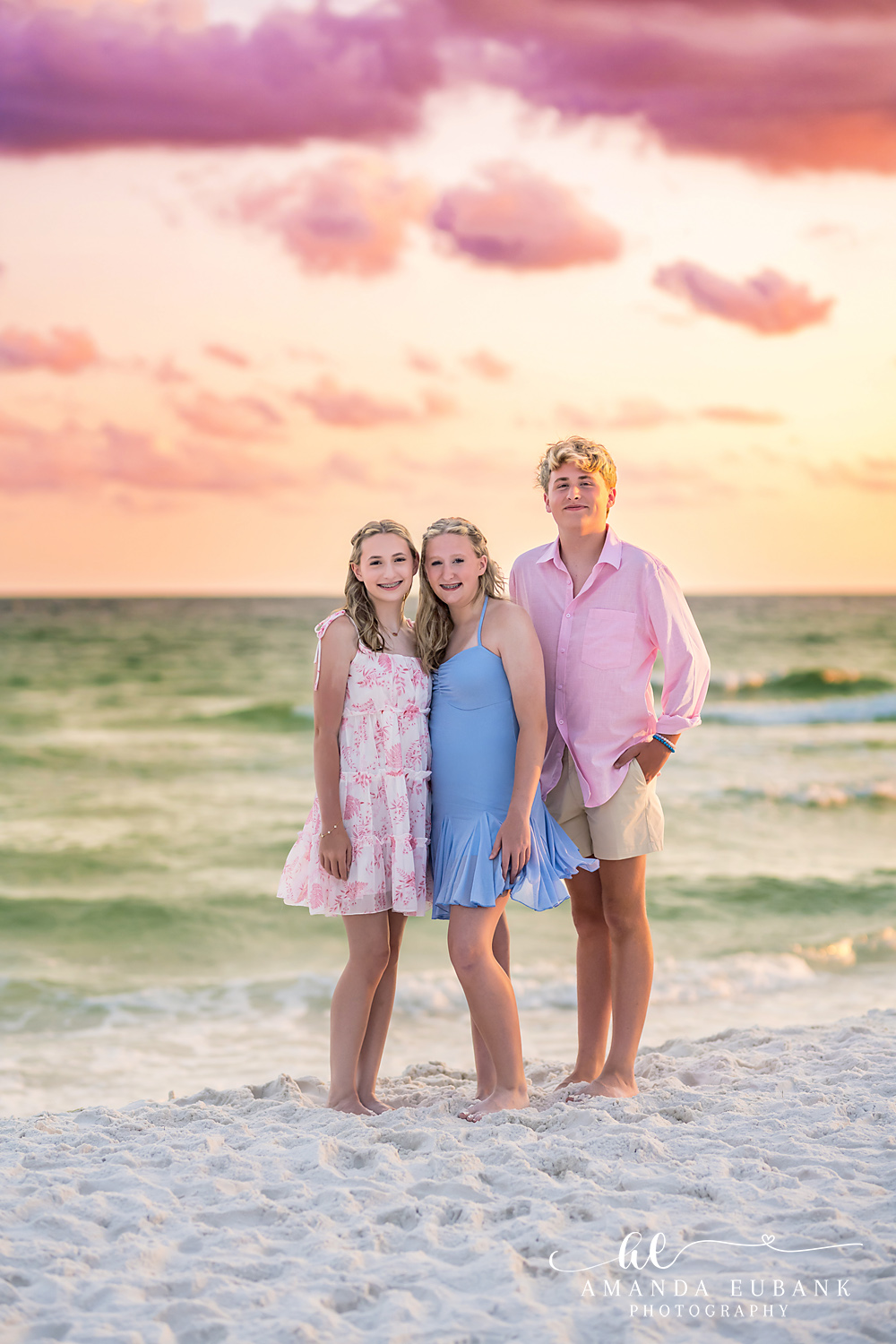 Destin Beach Photos – Mom and Daughters on the Shoreline Three family members on the sugar-white sand as the Destin sky turns pink and gold