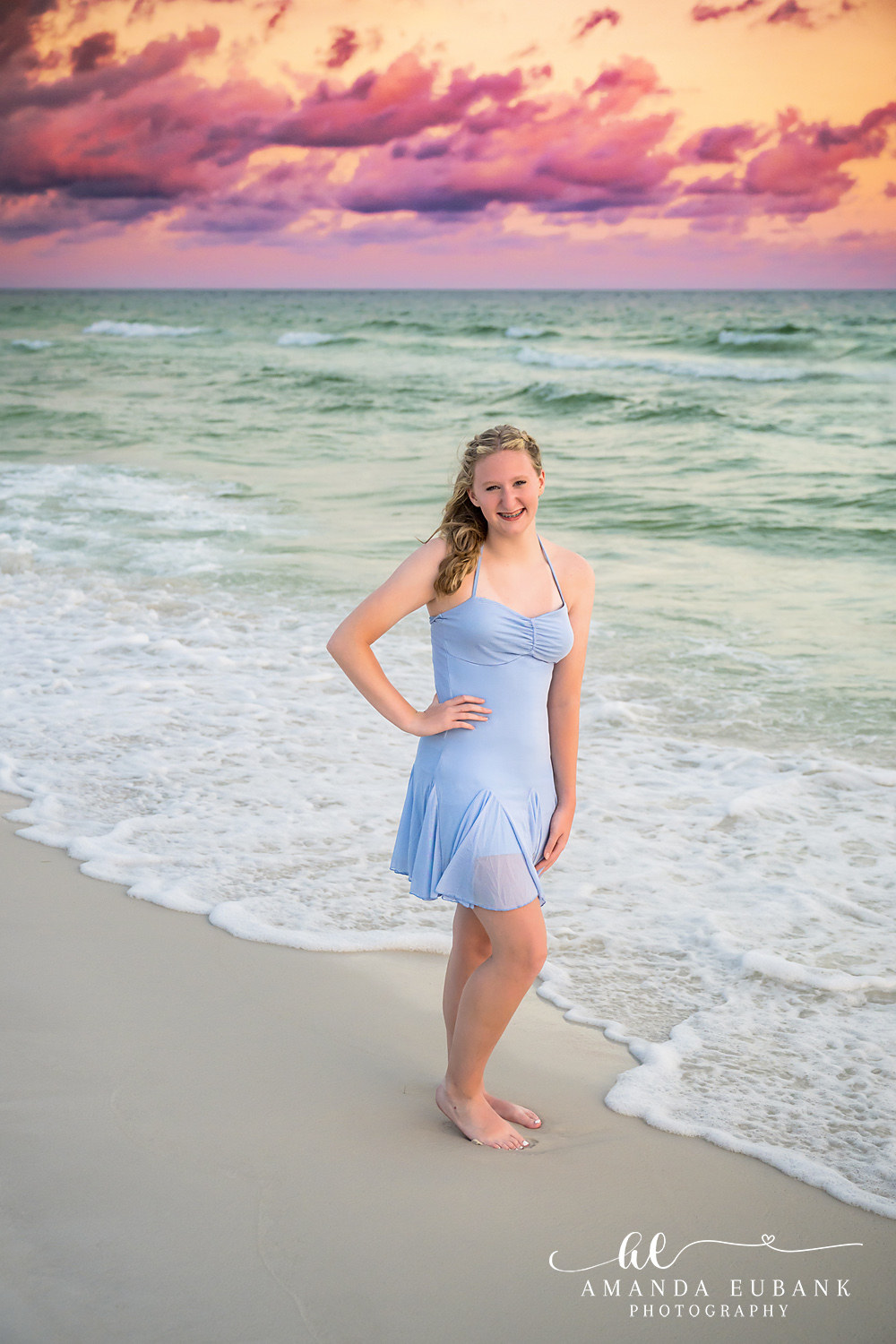 Destin Florida Teen Beach Portrait at the Water’s Edge Girl in a blue dress at the surf line in Destin with emerald water and a pastel sky