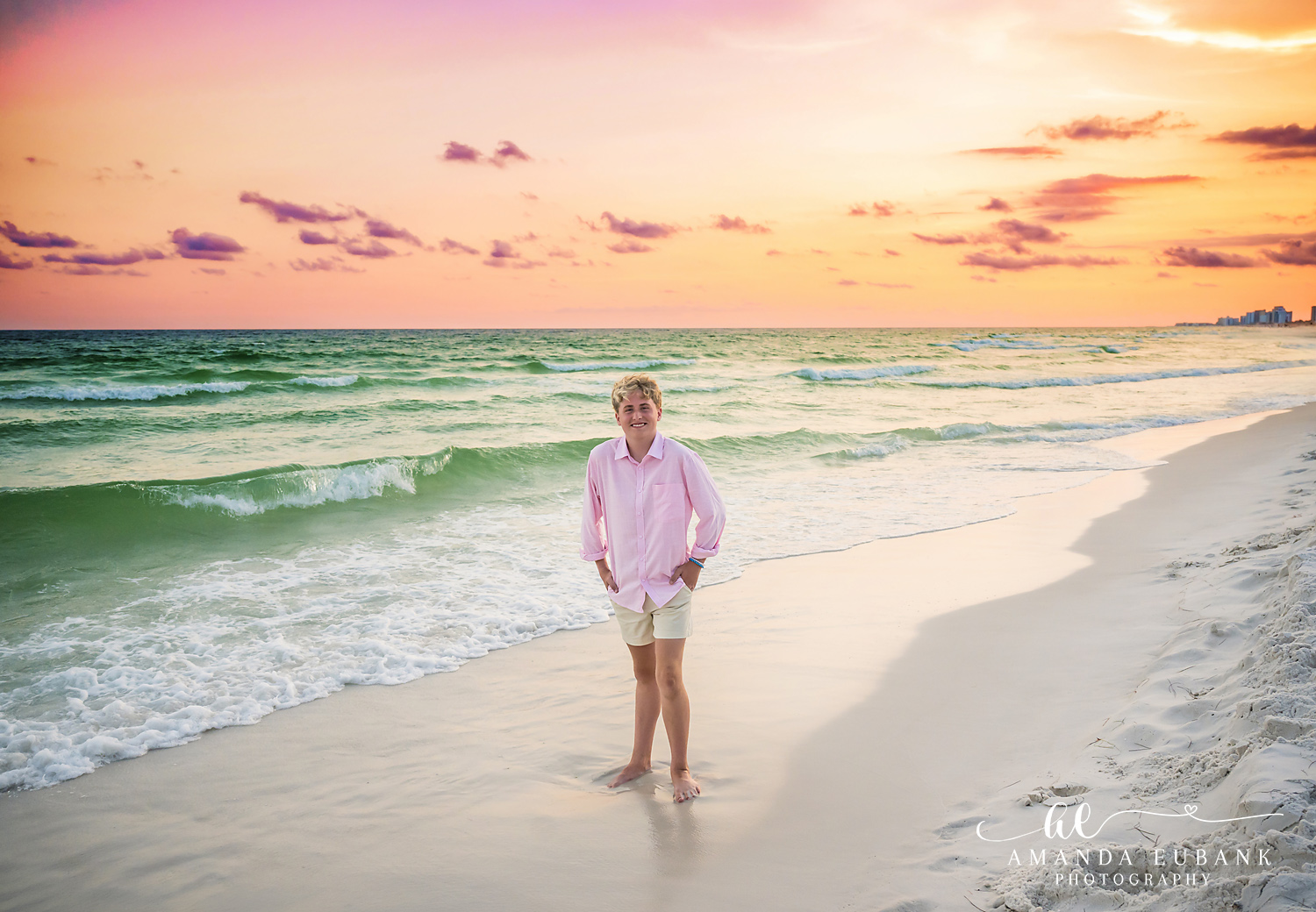 Destin Beach Portrait in Golden Sunset Light Person in a pink button-down standing in the shallow Gulf water at sunset in Destin