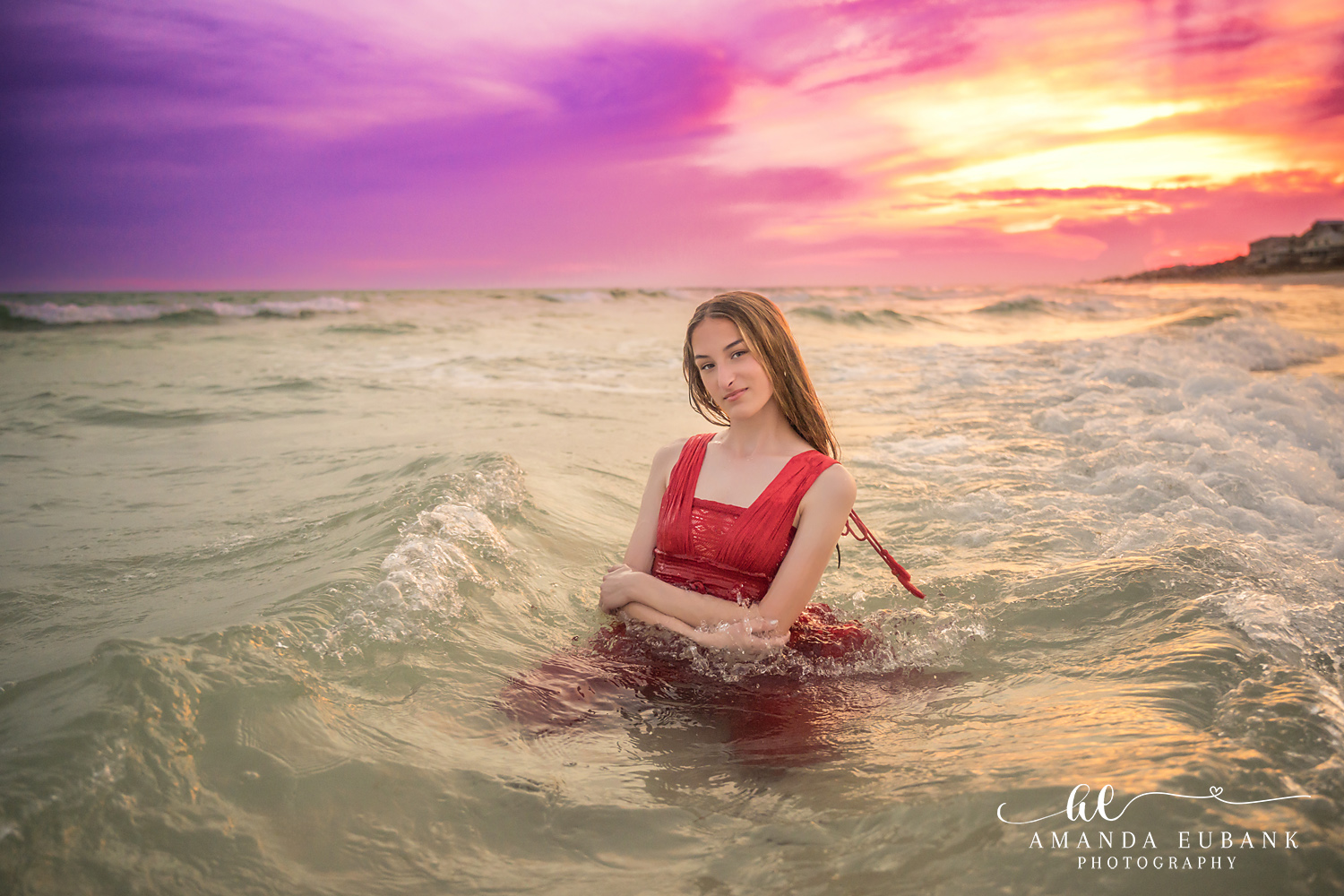 Rosemary Beach Senior Photographer – Red Dress in the Surf Senior girl in a red dress standing in the ocean waves in Rosemary Beach, Florida