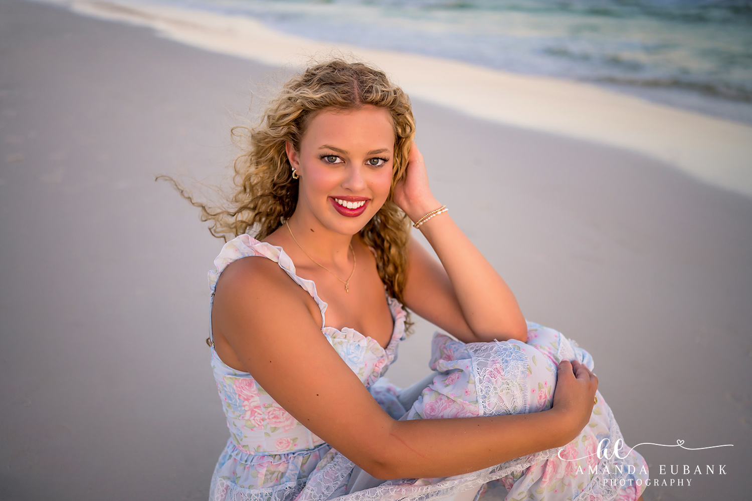 Sandestin Senior Photographer – Golden Hour Close-Up Close-up portrait of a senior with curly hair and a white dress at golden hour in Sandestin, Florida
