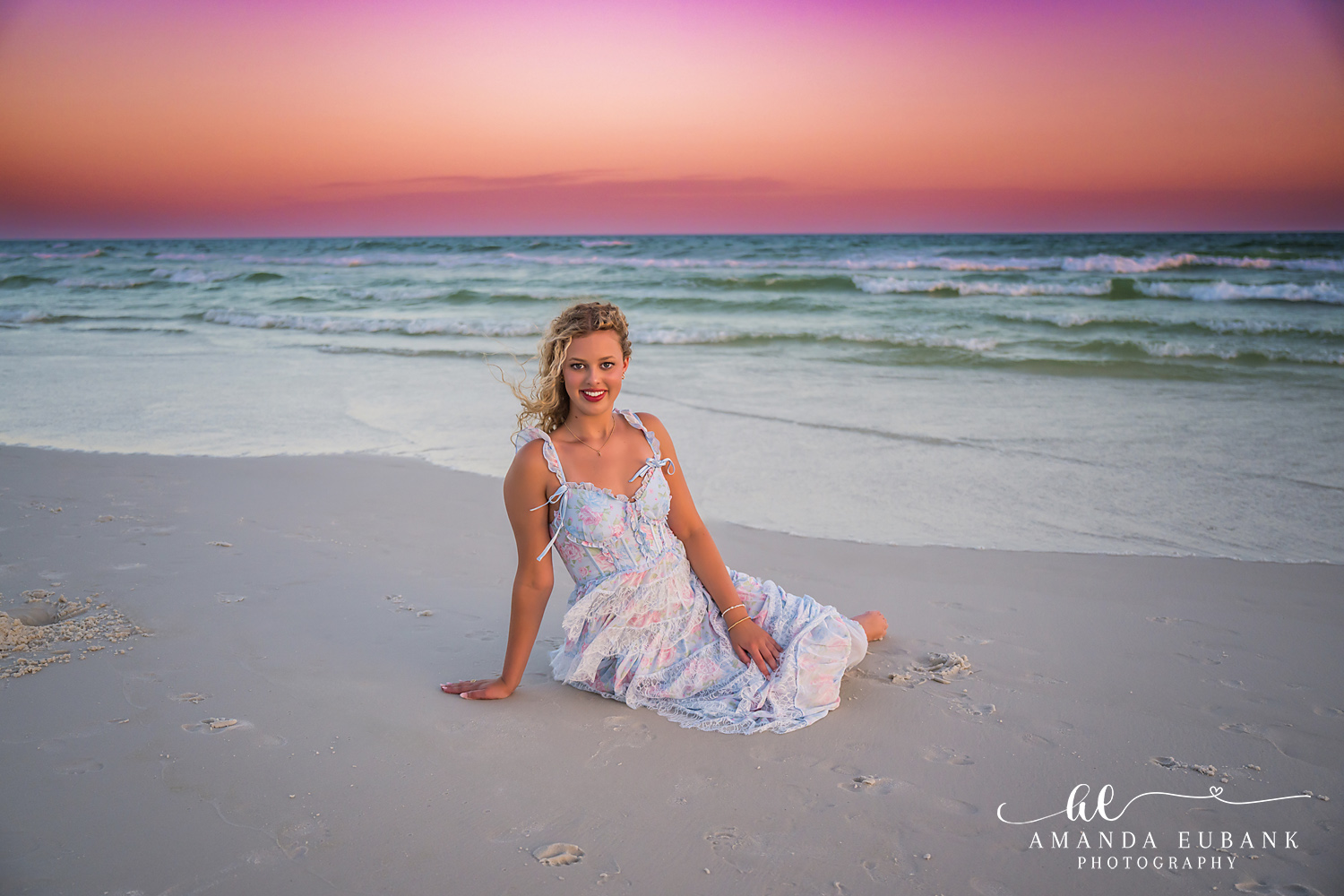 Sandestin Senior Photographer – Gazing at the Gulf Senior girl in a white dress standing on the beach looking out at the Gulf in Sandestin, Florida