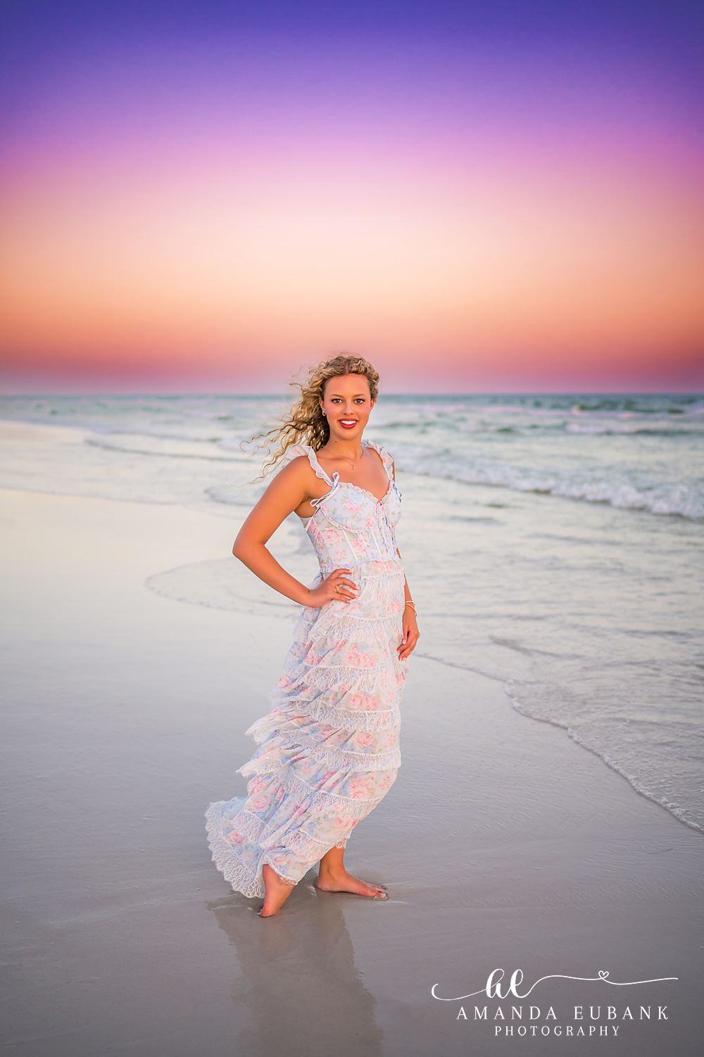Sandestin Senior Photographer – Soft Smile on the Shoreline Senior girl smiling softly on the shoreline in a white dress in Sandestin, Florida