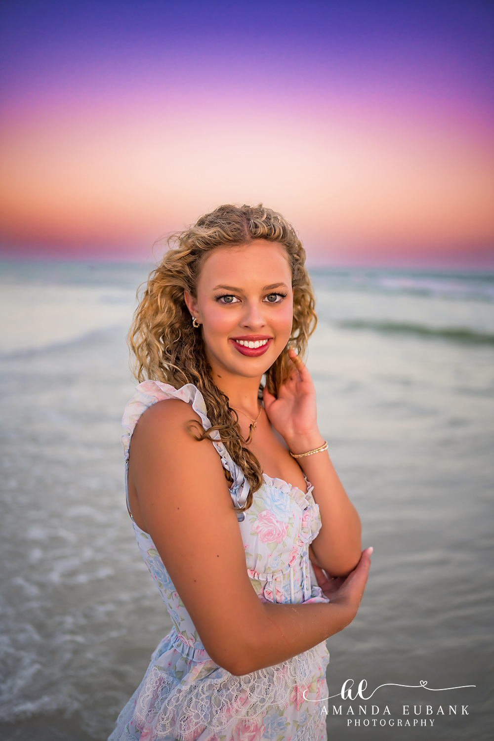 Sandestin Senior Photographer – Confident Stroll Along the Shore Senior in a white dress walking confidently along the shoreline in Sandestin, Florida