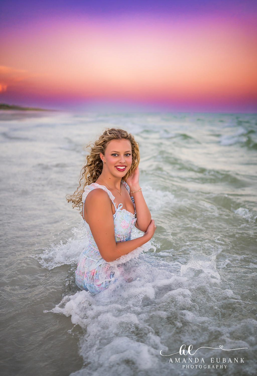 Sandestin Senior Photographer – Standing in the Gulf Waves Senior girl standing in the Gulf waves in a white dress in Sandestin, Florida