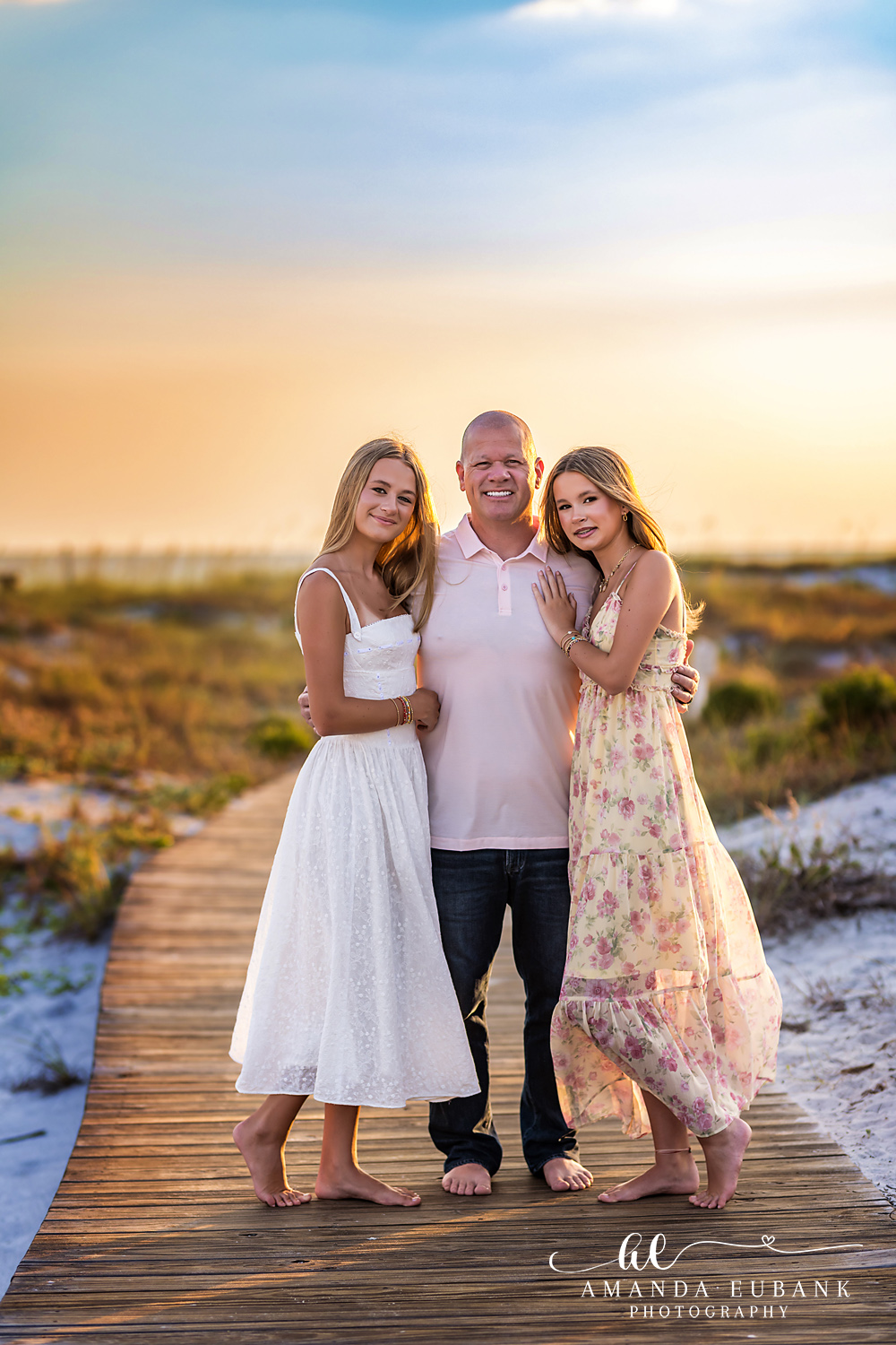 WaterSound Beach Father-Daughter Boardwalk Portrait Father and daughters posing together on the beach boardwalk at WaterSound Beach