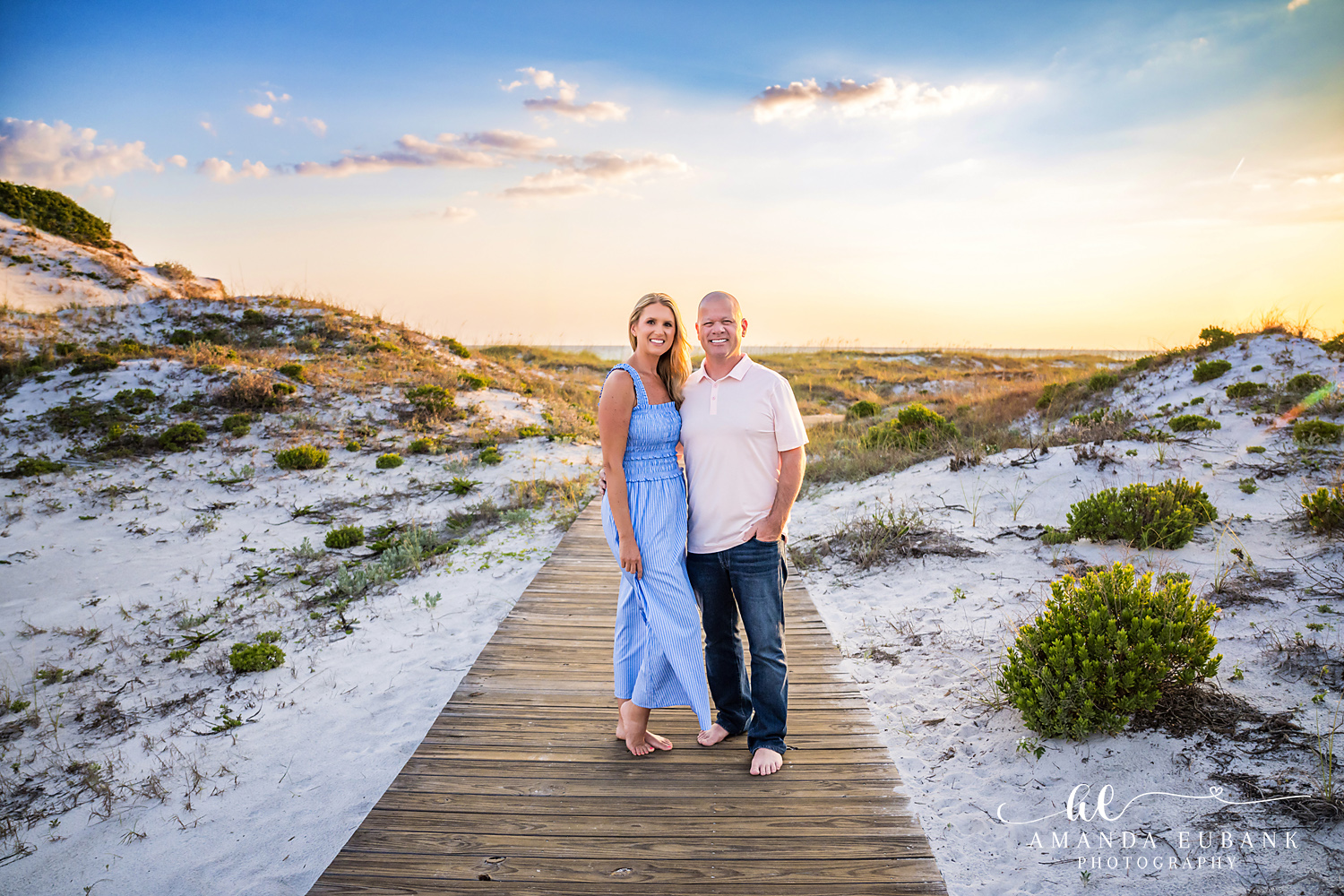 WaterSound Beach Boardwalk Portrait at Sunset Couple standing on a wooden beach boardwalk at sunset near WaterSound Beach