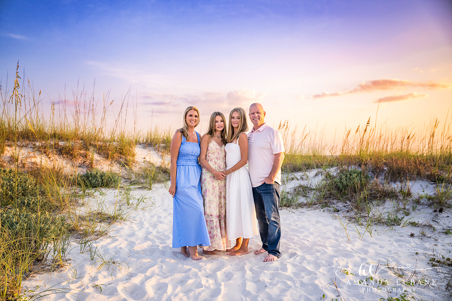 WaterSound Beach Family Portrait – Wide Dune Landscape Family of four posing together on the dunes at WaterSound Beach during sunset