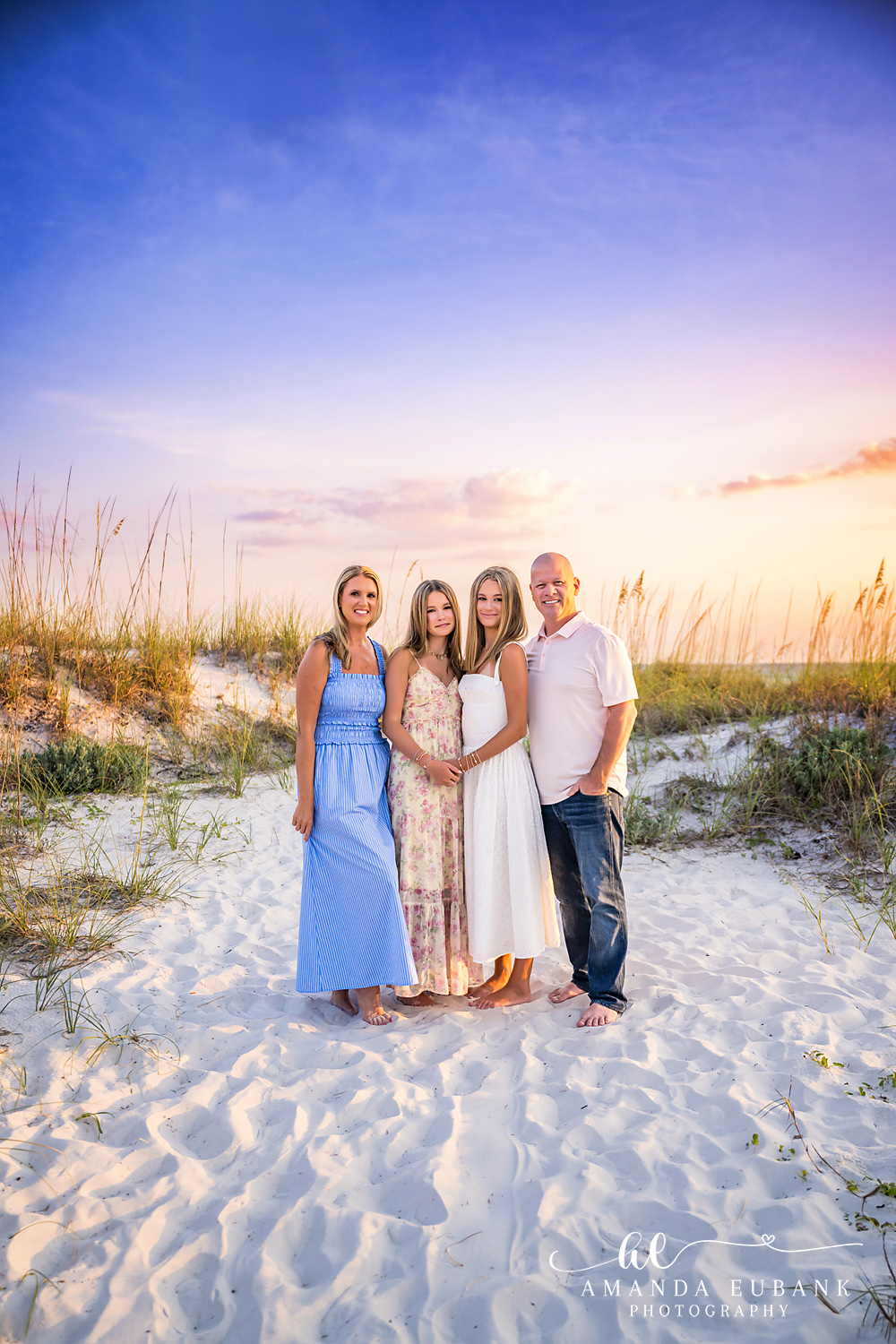 WaterSound Beach Family Portrait Among the Dunes Family of four standing together among sand dunes and sea oats at WaterSound Beach