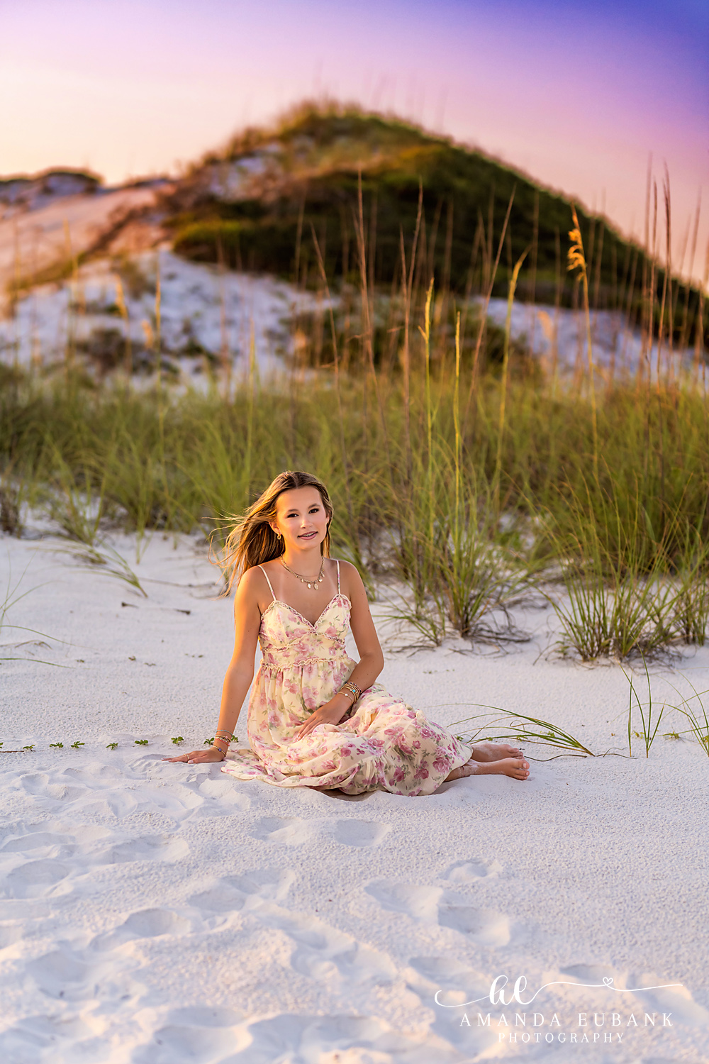 WaterSound Beach Sand Dune Portrait at Golden Hour Teen girl sitting among sea oats on a sand dune at golden hour on WaterSound Beach