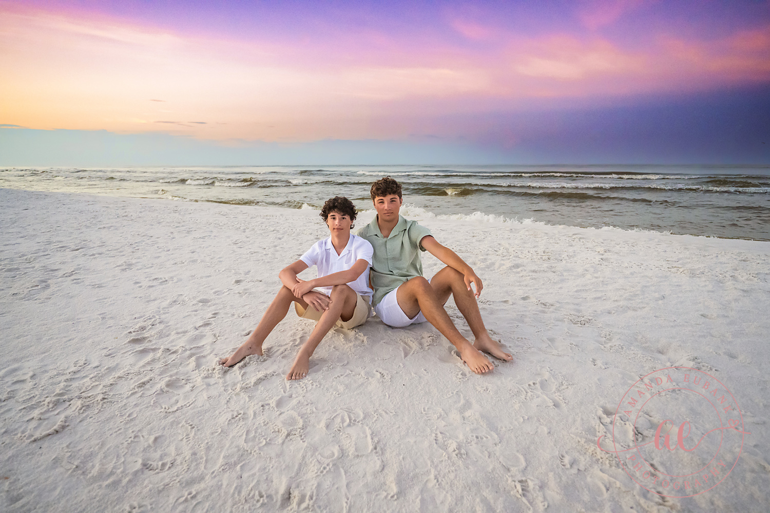 Miramar Beach Sunrise Family Photos | Two brothers sitting in the sand Two brothers sitting in the sand on the beach in Miramar Beach, Florida at sunrise, photographed by Miramar Beach family photographer Amanda Eubank