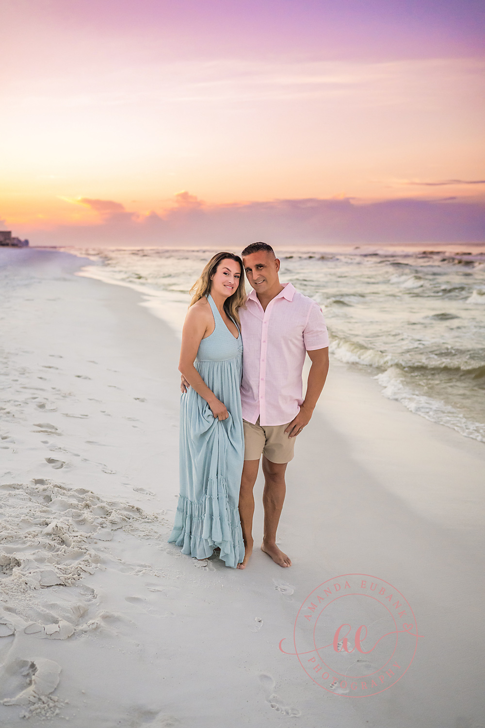 Miramar Beach Sunrise Family Photos | Mom and dad posing together Mom and dad posing together on the beach in Miramar Beach, Florida at sunrise, photographed by Miramar Beach family photographer Amanda Eubank