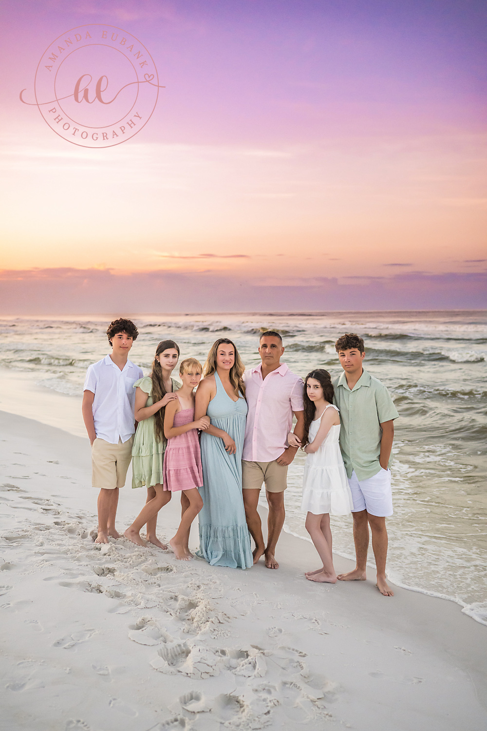 Miramar Beach Sunrise Family Photos | Whole family standing together The whole family standing together on the beach in Miramar Beach, Florida at sunrise, photographed by Miramar Beach family photographer Amanda Eubank
