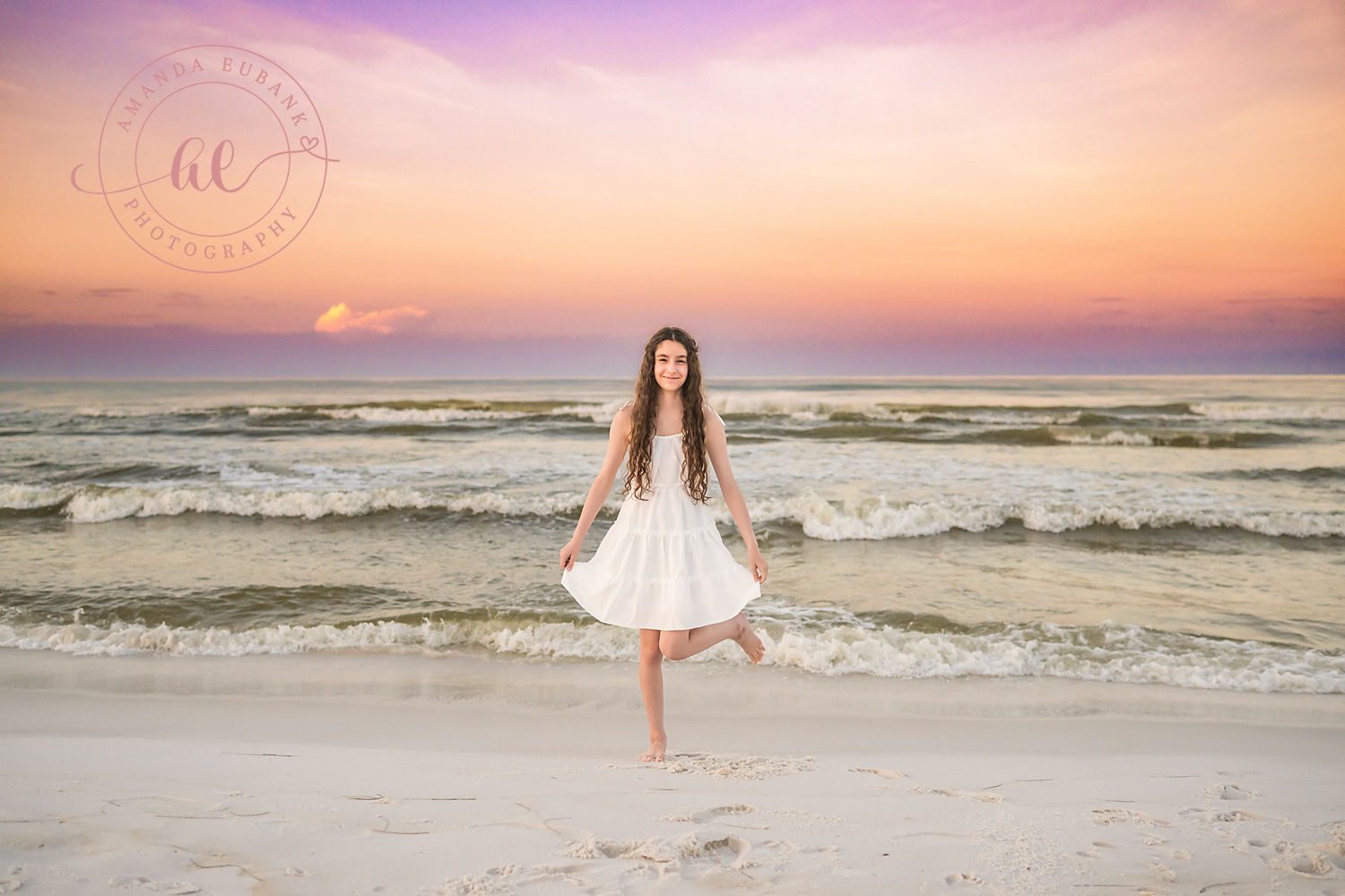 Miramar Beach Sunrise Family Photos | Girl twirling in a white dress A girl twirling in a white dress on the beach in Miramar Beach, Florida at sunrise, photographed by Miramar Beach family photographer Amanda Eubank