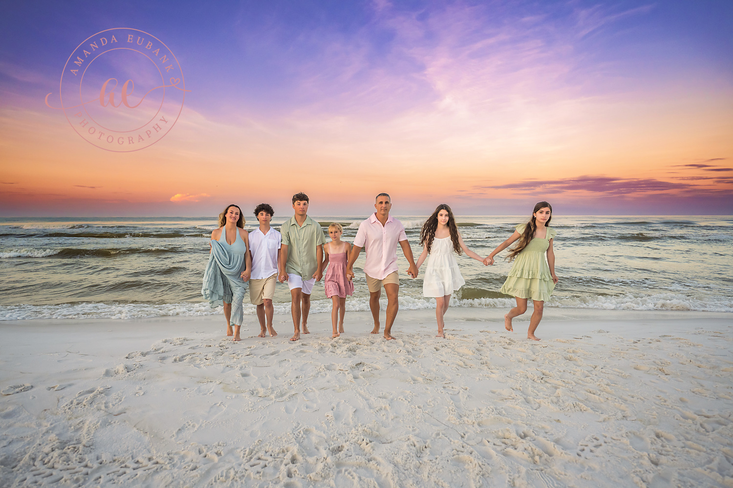 Miramar Beach Sunrise Family Photos | Family standing in a line A family standing in a line on the beach in Miramar Beach, Florida at sunrise, photographed by Miramar Beach family photographer Amanda Eubank
