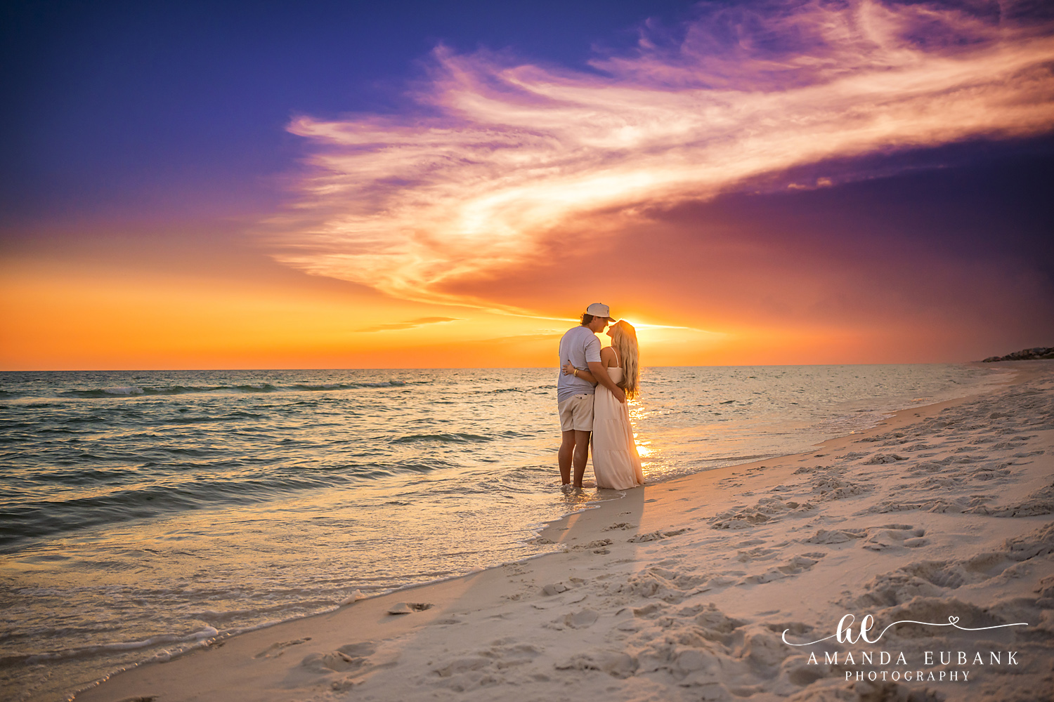 Rosemary Beach Family Photos | Couple silhouetted in an embrace A couple silhouetted in an embrace on the beach in Rosemary Beach, Florida at sunset, photographed by Rosemary Beach family photographer Amanda Eubank