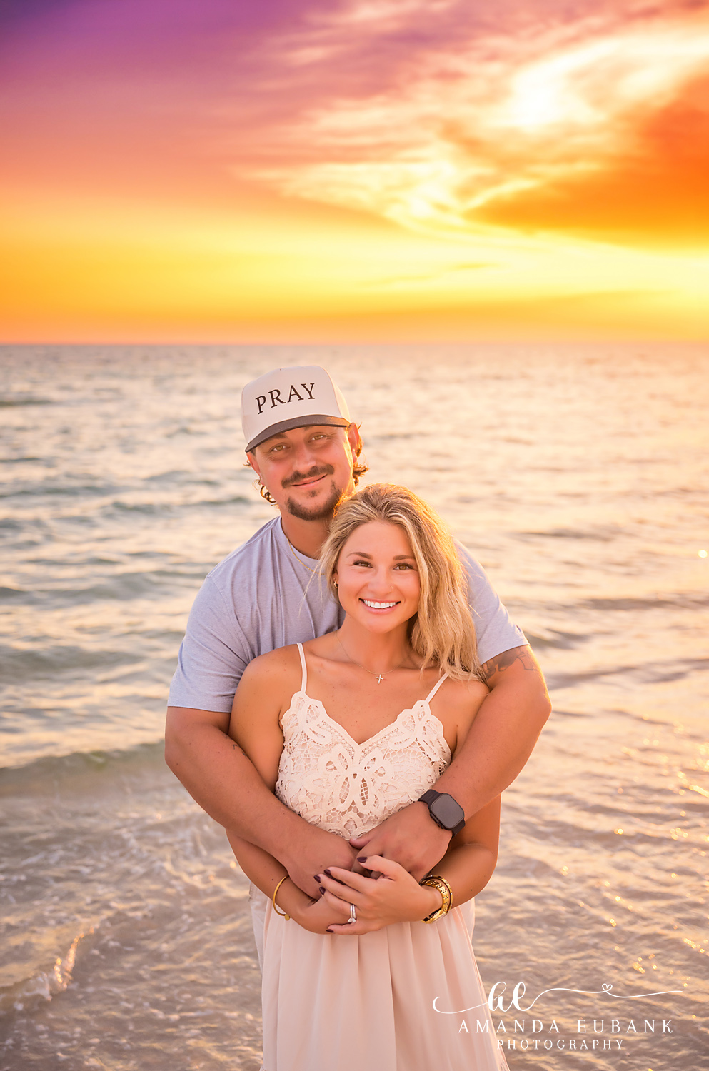 Rosemary Beach Family Photos | Couple close-up, husband hugging his wife A couple close-up, husband hugging his wife on the beach in Rosemary Beach, Florida at sunset, photographed by Rosemary Beach family photographer Amanda Eubank