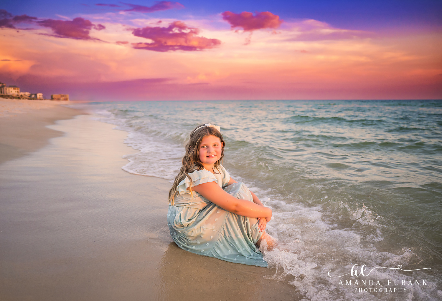 Rosemary Beach Family Photos | Girl sitting at the water’s edge A girl sitting at the water's edge on the beach in Rosemary Beach, Florida at sunset, photographed by Rosemary Beach family photographer Amanda Eubank