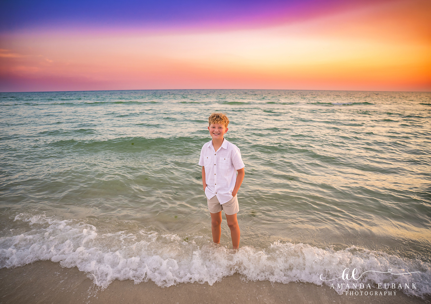 Rosemary Beach Family Photos | Boy standing in the surf A boy standing in the surf on the beach in Rosemary Beach, Florida at sunset, photographed by Rosemary Beach family photographer Amanda Eubank