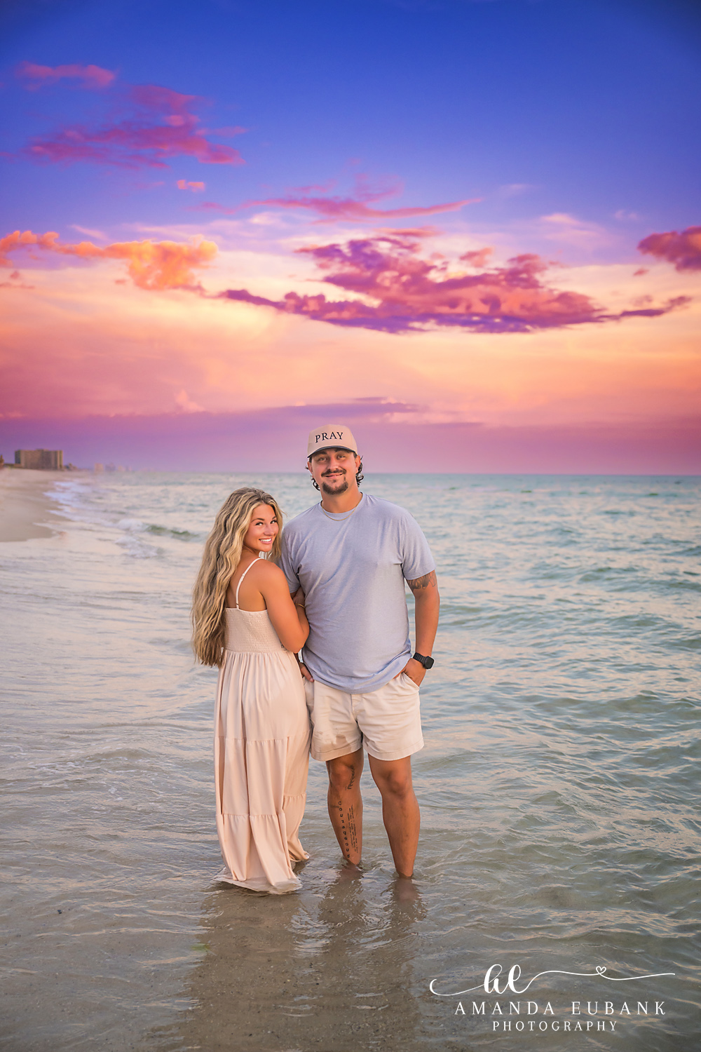 Rosemary Beach Family Photos | Couple standing in the surf A couple standing in the surf on the beach in Rosemary Beach, Florida at sunset, photographed by Rosemary Beach family photographer Amanda Eubank
